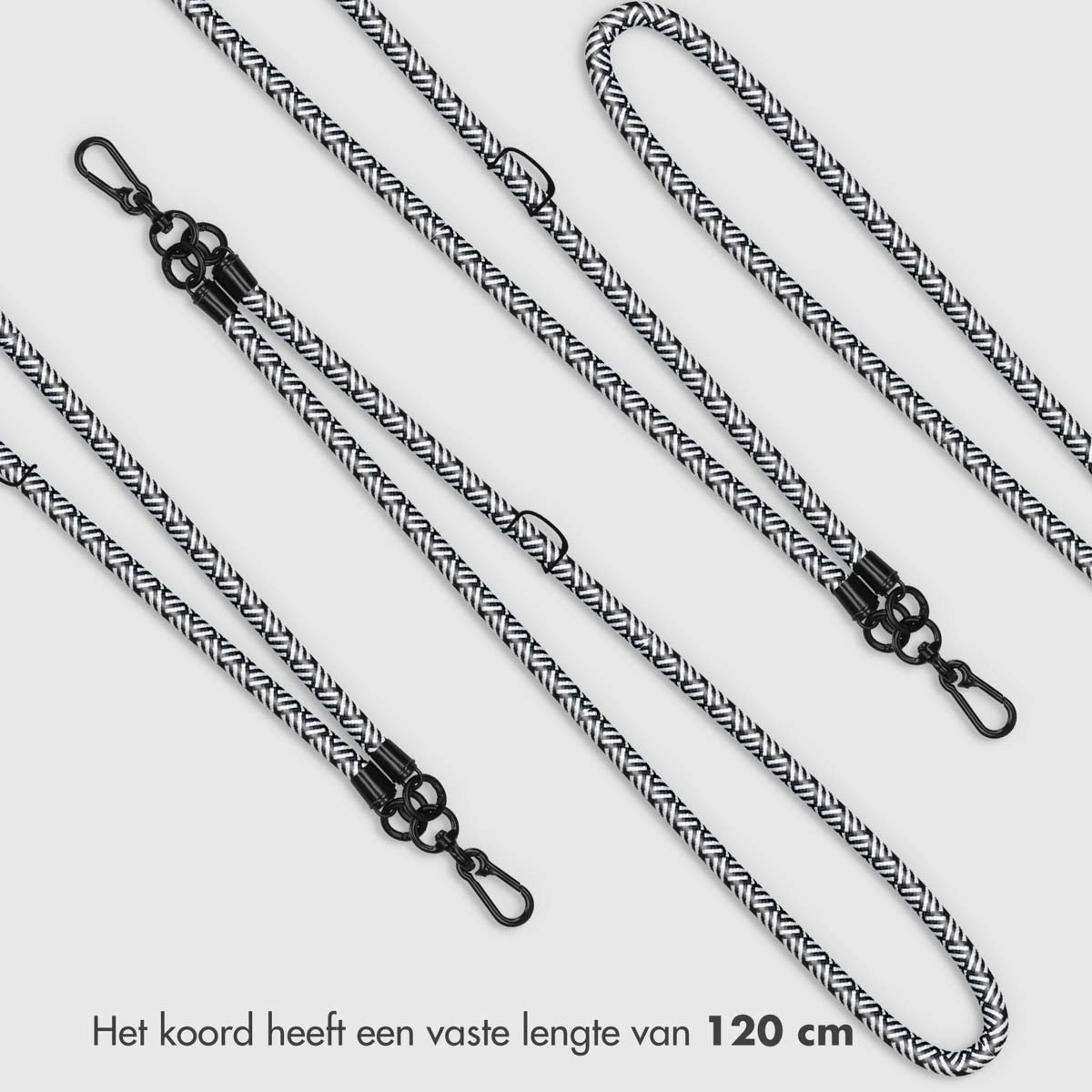 Meerdere zwart-witte koorden met clips, van bovenaf gezien op een licht oppervlak.