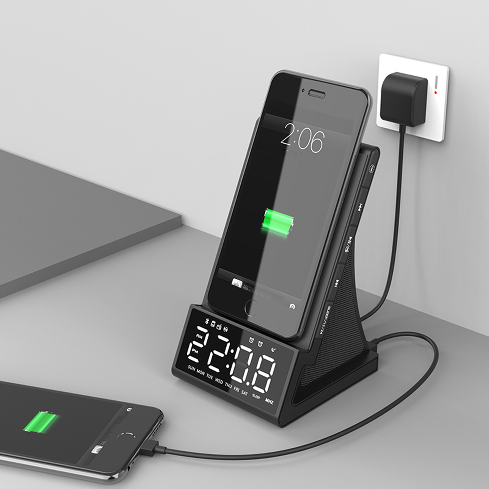 Ein Telefon, das an einer Ladestation geladen wird, ein weiteres Telefon, das sich links auflädt.