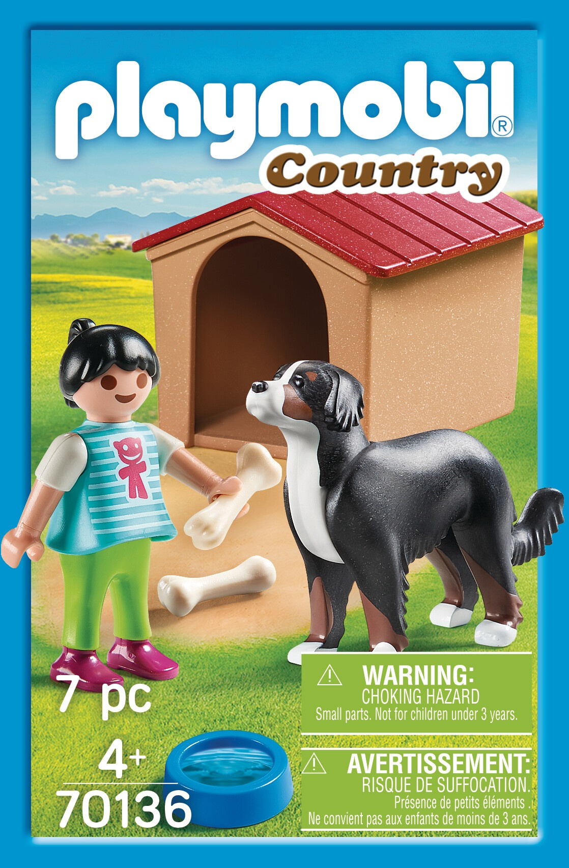 Set Playmobil Country con bambina, cane, cuccia e ossa. Cielo blu e erba verde sullo sfondo.