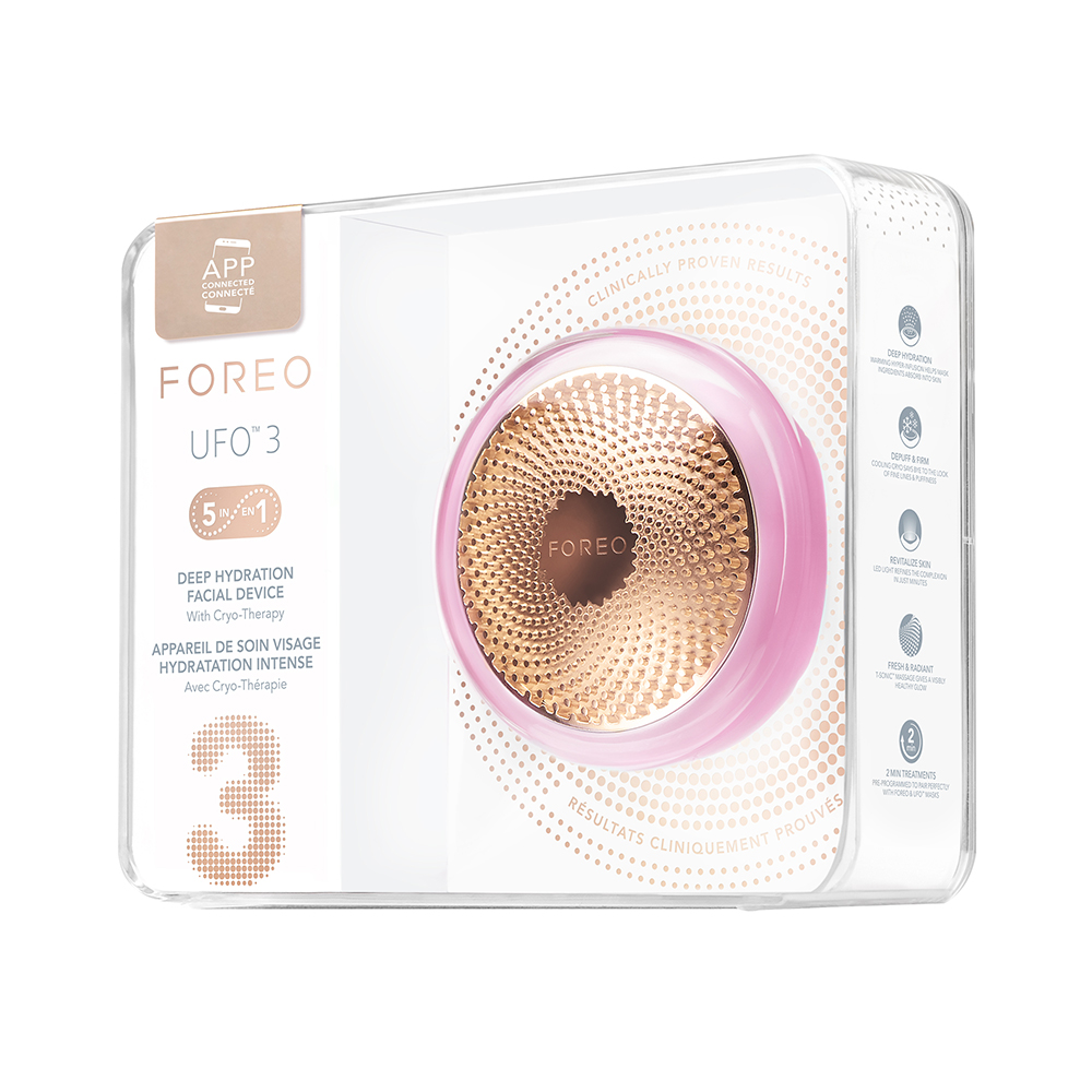 Pink and gold facial device in a box. Text says 'FOREO UFO 3' and describes its features.