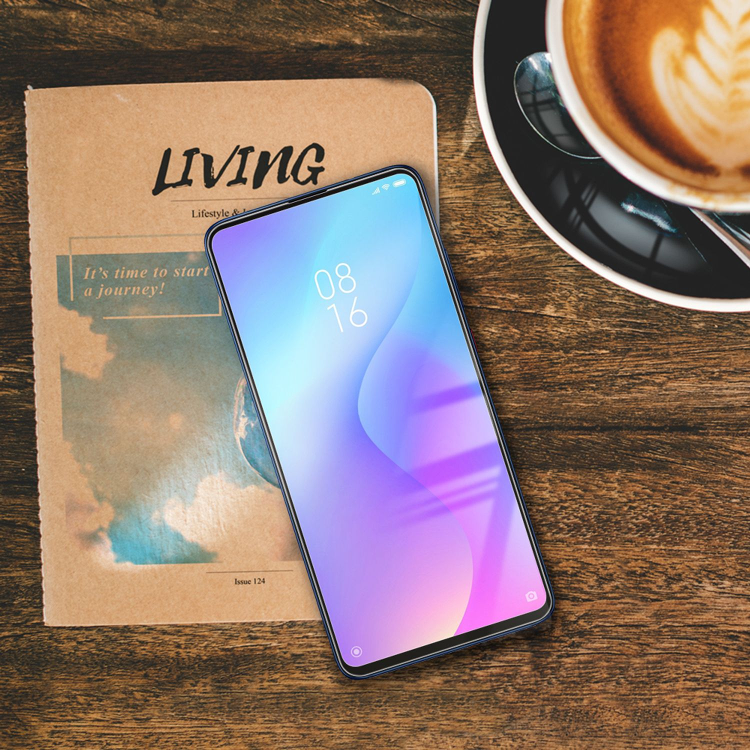 Téléphone sur un livre. Un téléphone avec un écran coloré est posé sur un livre.