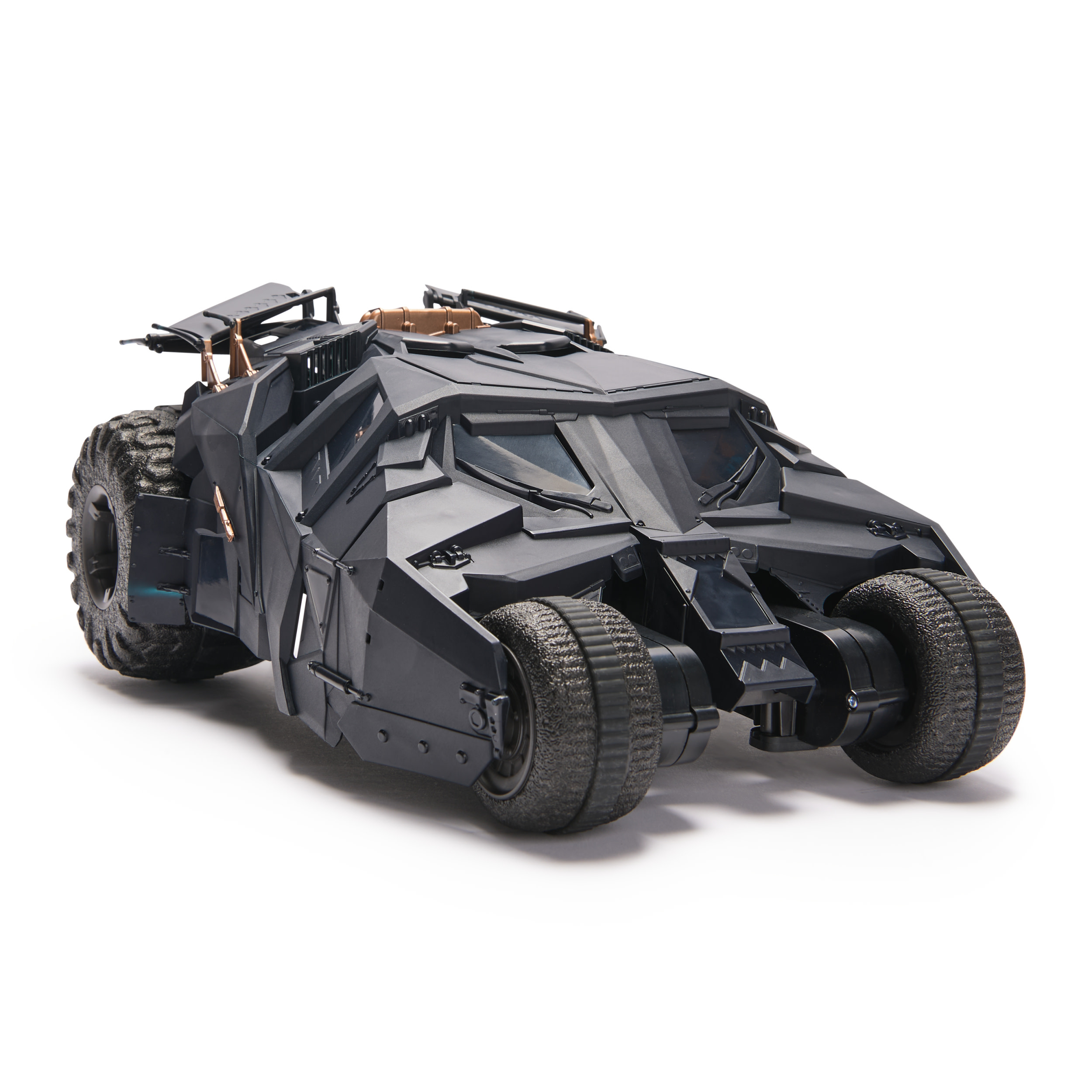 Coche de juguete Batman negro con neumáticos grandes, sobre fondo blanco.
