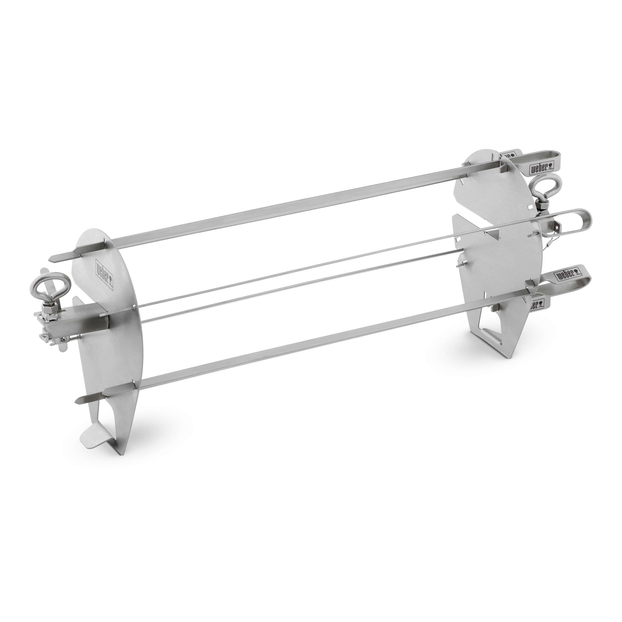 Un accesorio de asador Weber de acero inoxidable con tres brochetas, sobre un fondo blanco.