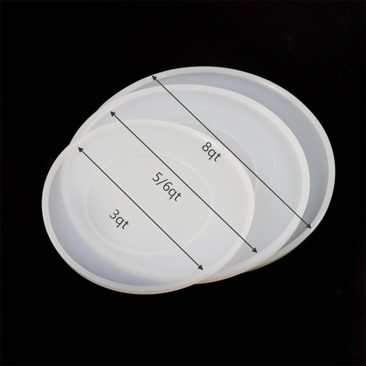 Three white, shallow, circular containers of different sizes, used for food storage.