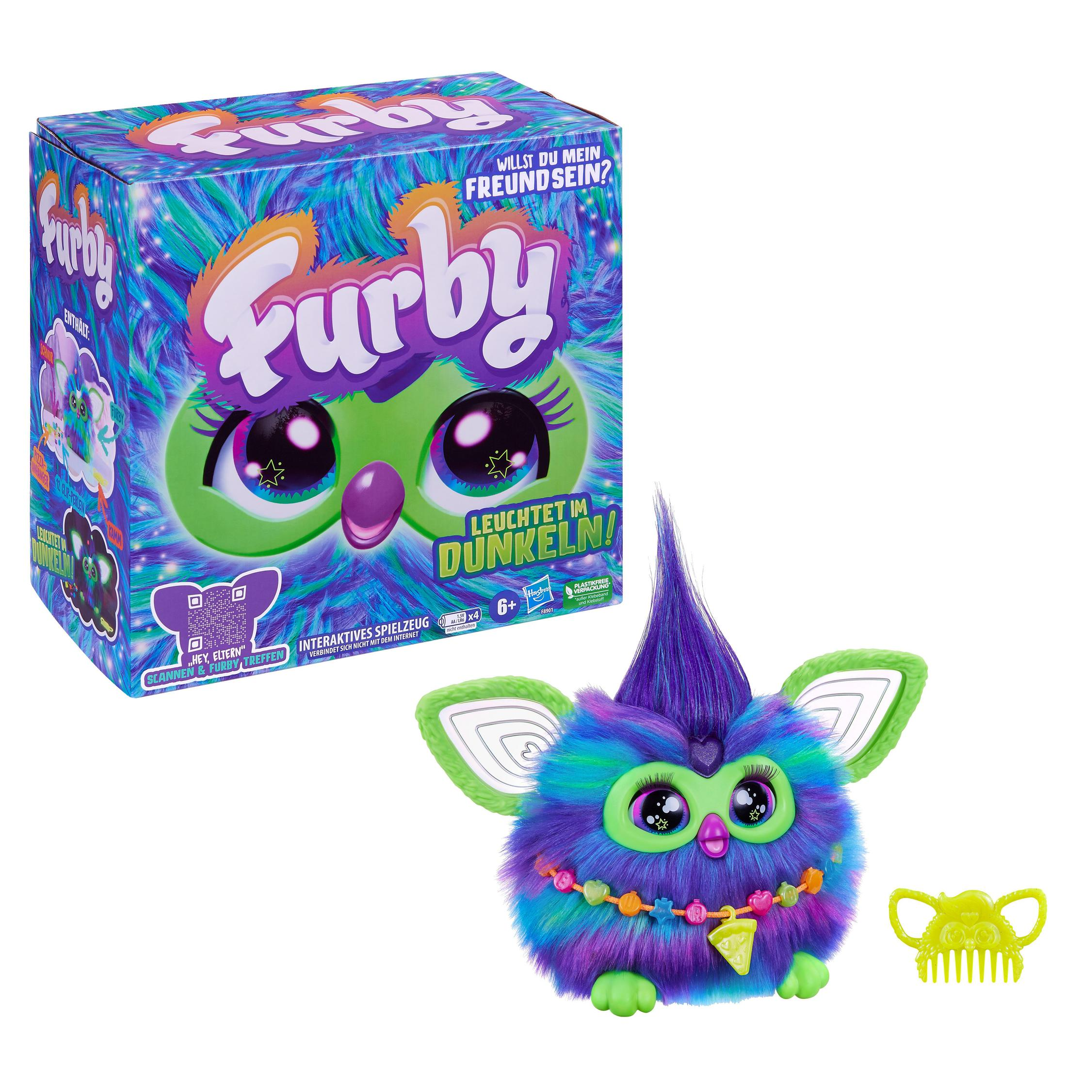 Zabawka Furby z pudełkiem, zielona i fioletowa. Na pudełku "Furby" i "Świeci w ciemności!"