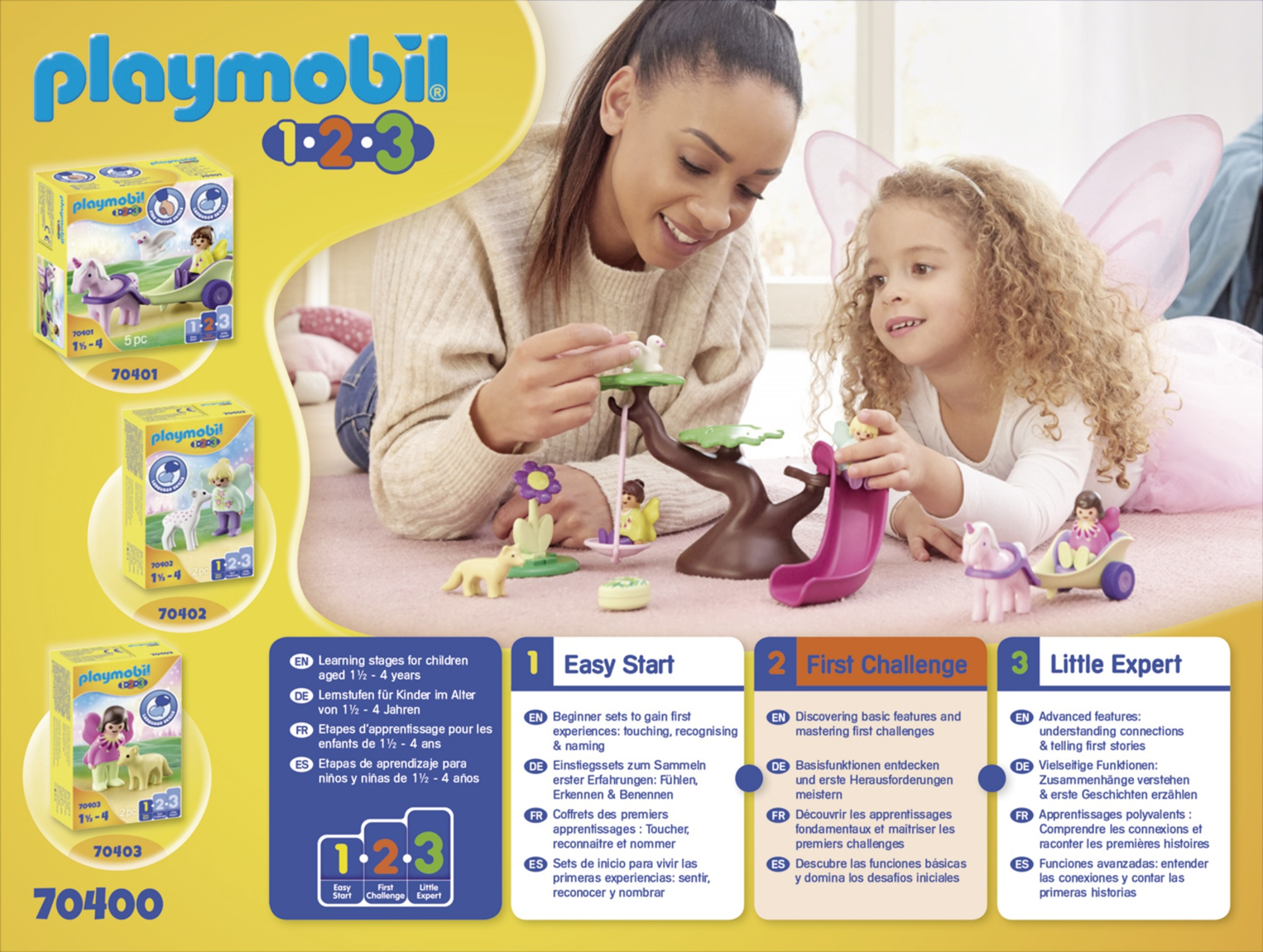 Due bambini che giocano con i giocattoli Playmobil su un tavolo. Sfondo bianco.