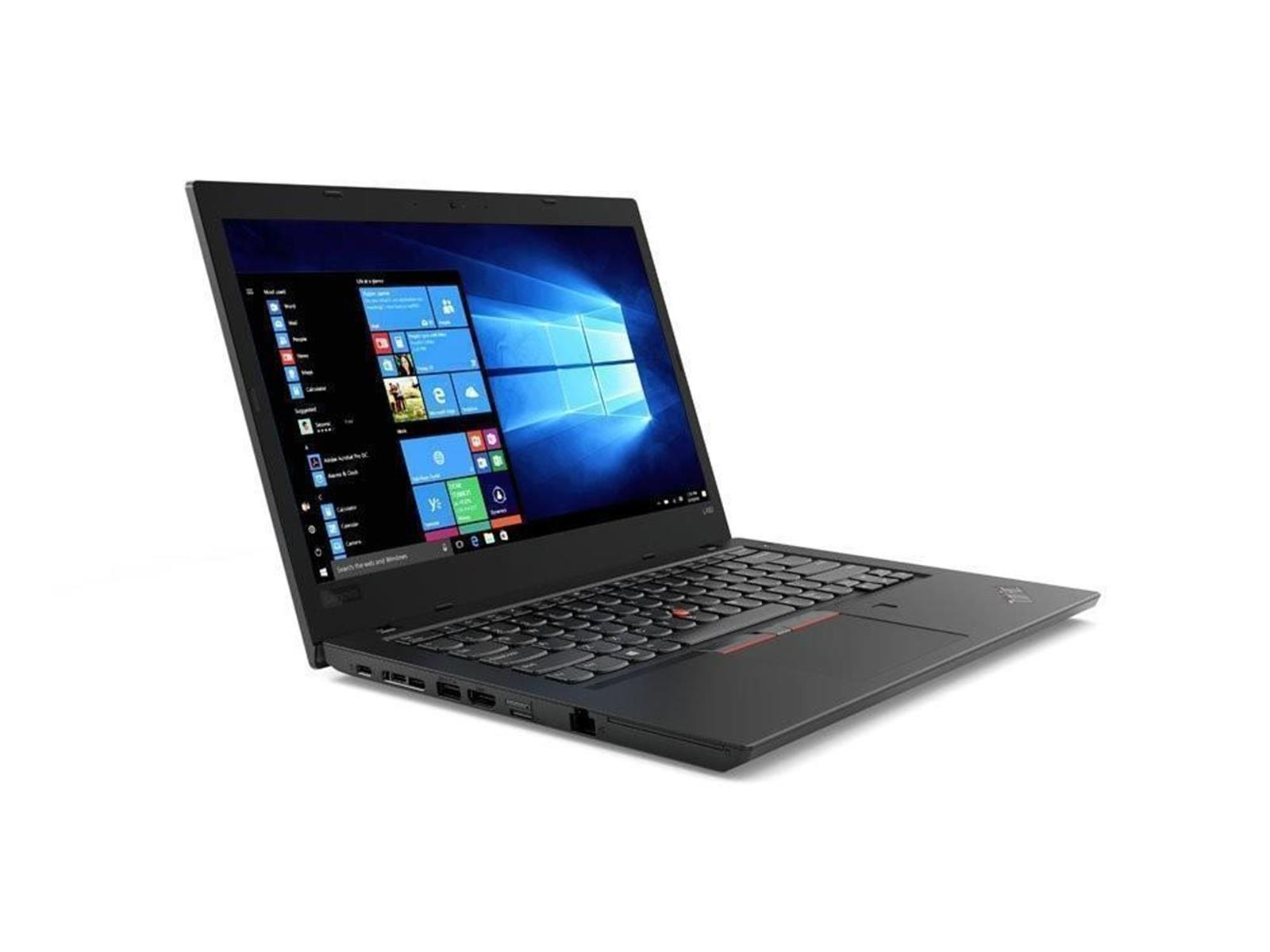 Ein schwarzer Laptop mit geöffnetem Windows-Startbildschirm, der auf einer weißen Oberfläche liegt.