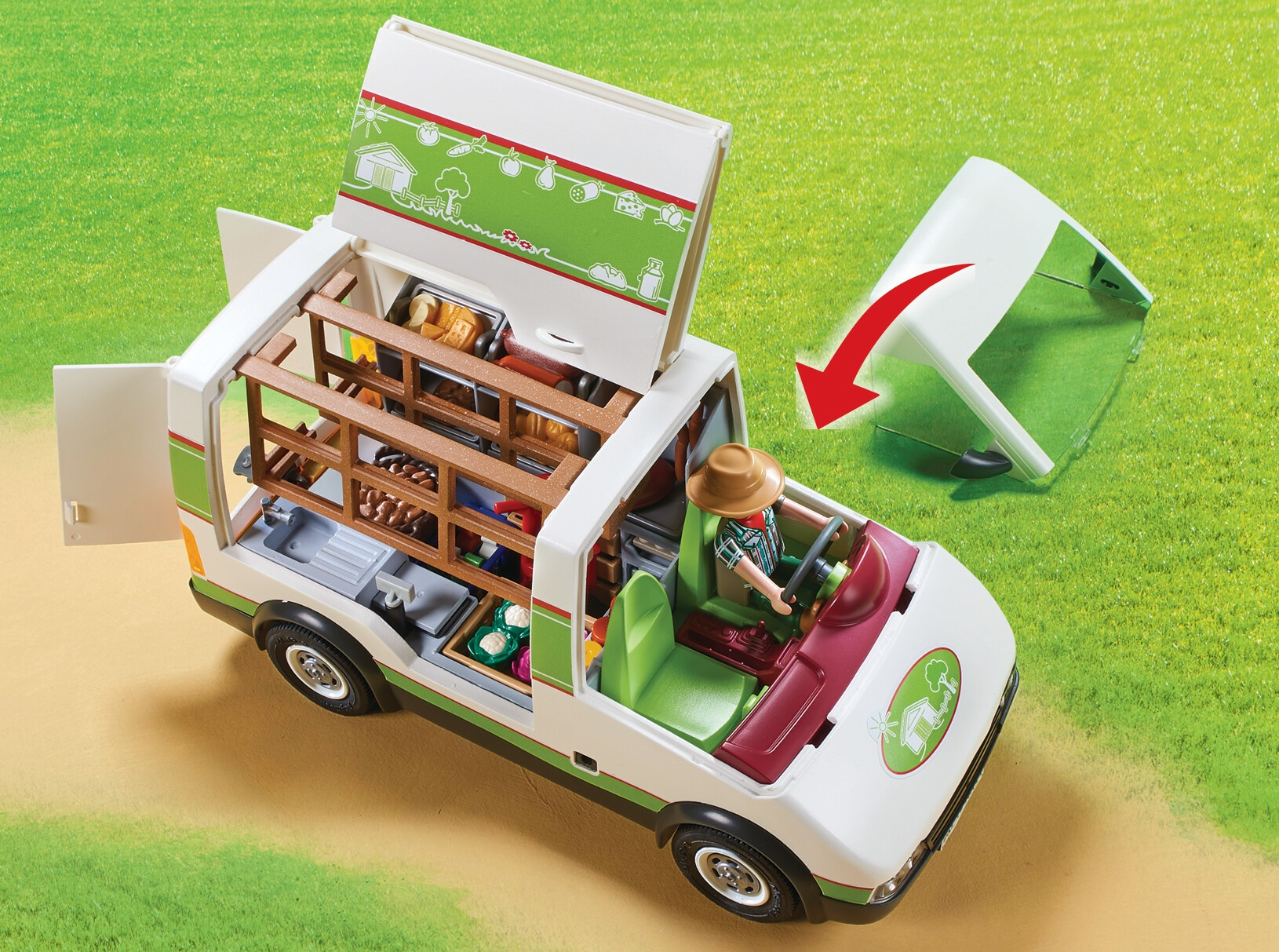 Zabawkowy food truck z otwartym tyłem, figurką rolnika i skrzynkami warzyw na trawie.