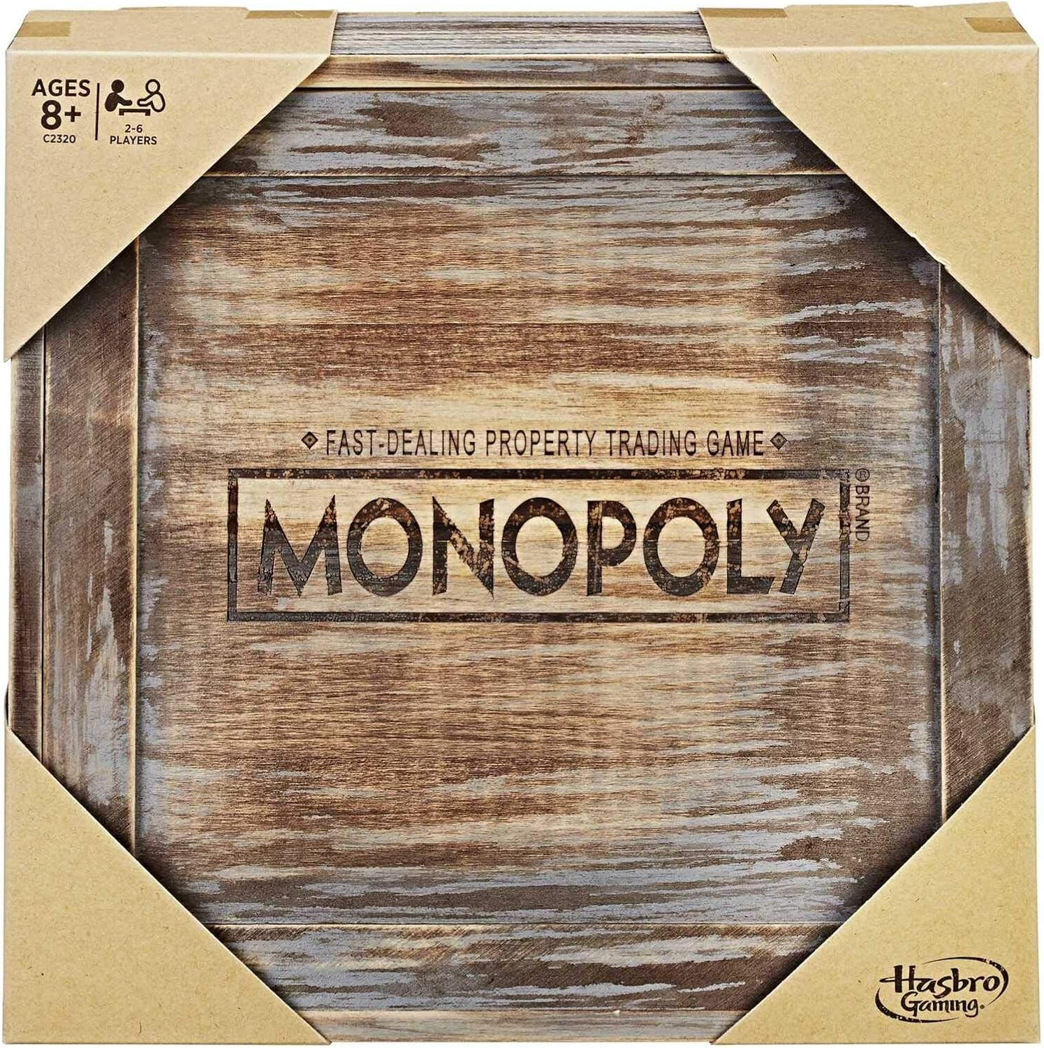 Monopoly-Spielbox. Die Box ist braun mit Holzmaserung. Text: SCHNELLES IMMOBILIENGESCHÄFT.