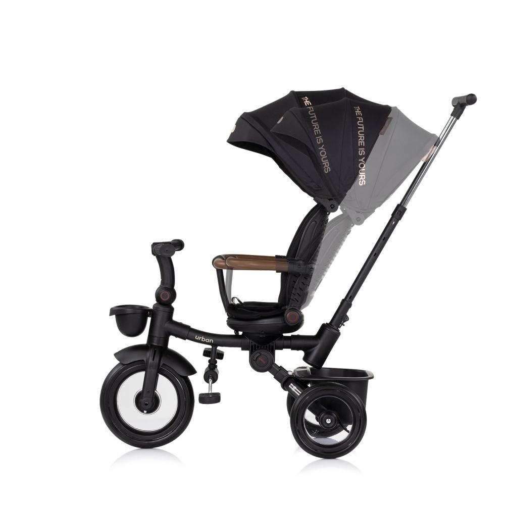 Triciclo negro con capota negra y el texto 'THE FUTURE IS YOURS'. Fondo blanco.