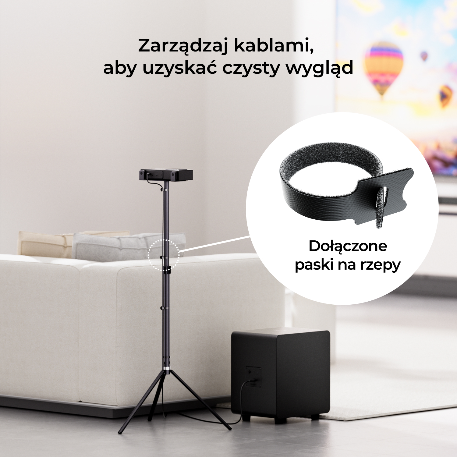 Czarny stojak z głośnikiem, czarnym subwooferem i paskiem na rzep w salonie.