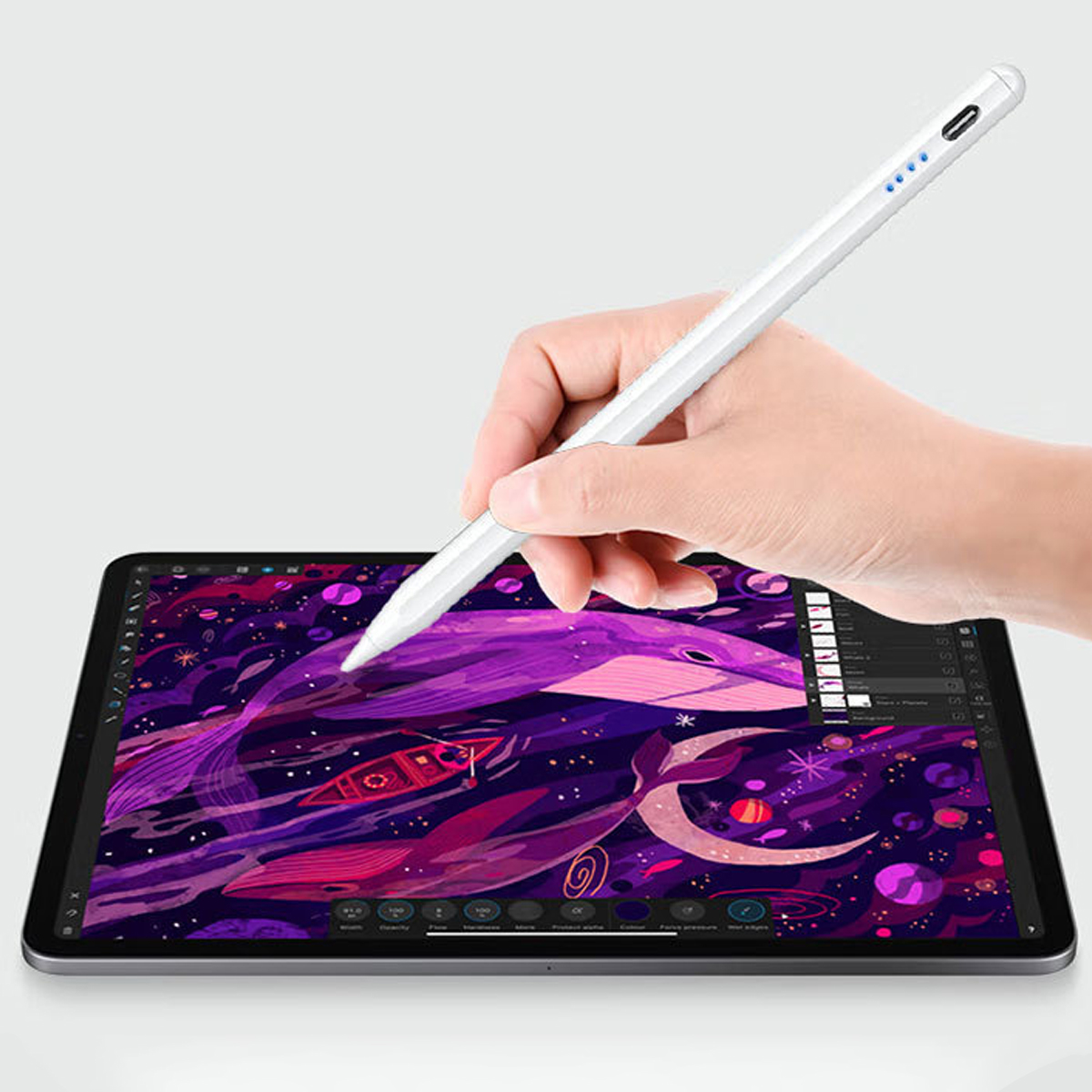 Eine Hand, die einen weißen Stift verwendet, um auf einem Tablet eine lila Galaxie zu zeichnen.