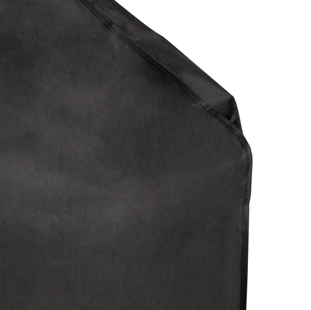 Black fabric. A close-up of a fabric with a seam on the edge. White background.