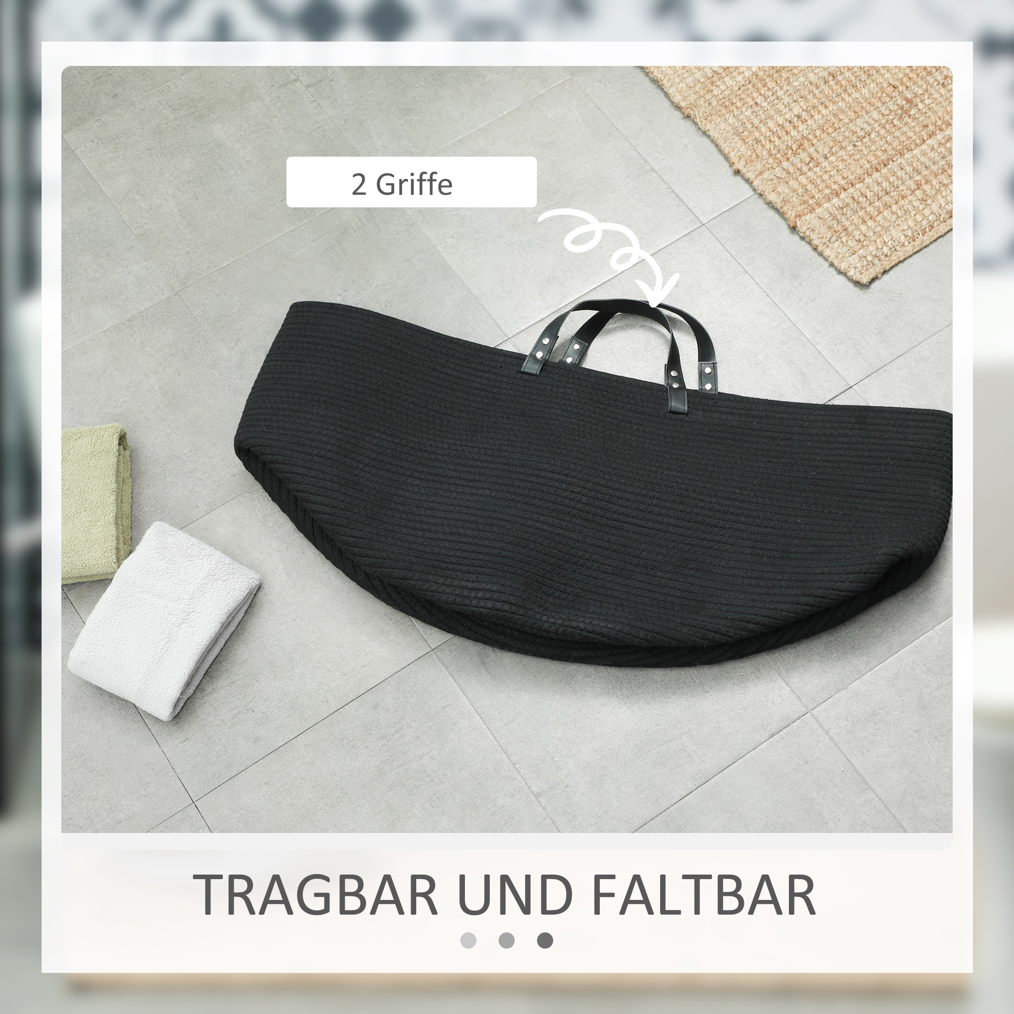 Schwarzer gewebter Korb mit Griffen, Handtüchern und Text.