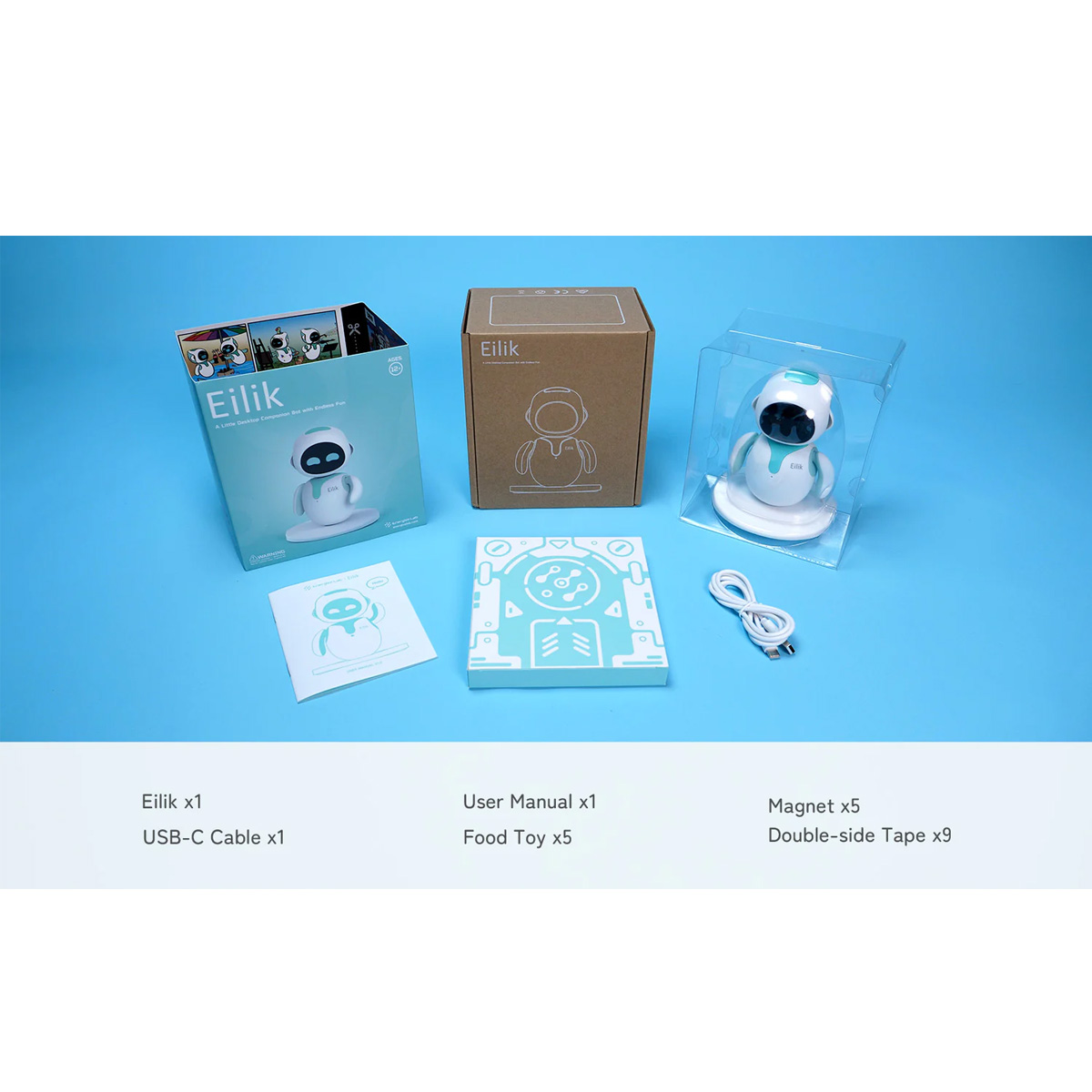 Ausgepacktes Roboter-Spielzeug mit Zubehör, einschließlich Benutzerhandbuch, Kabel und Futterspielzeug.
