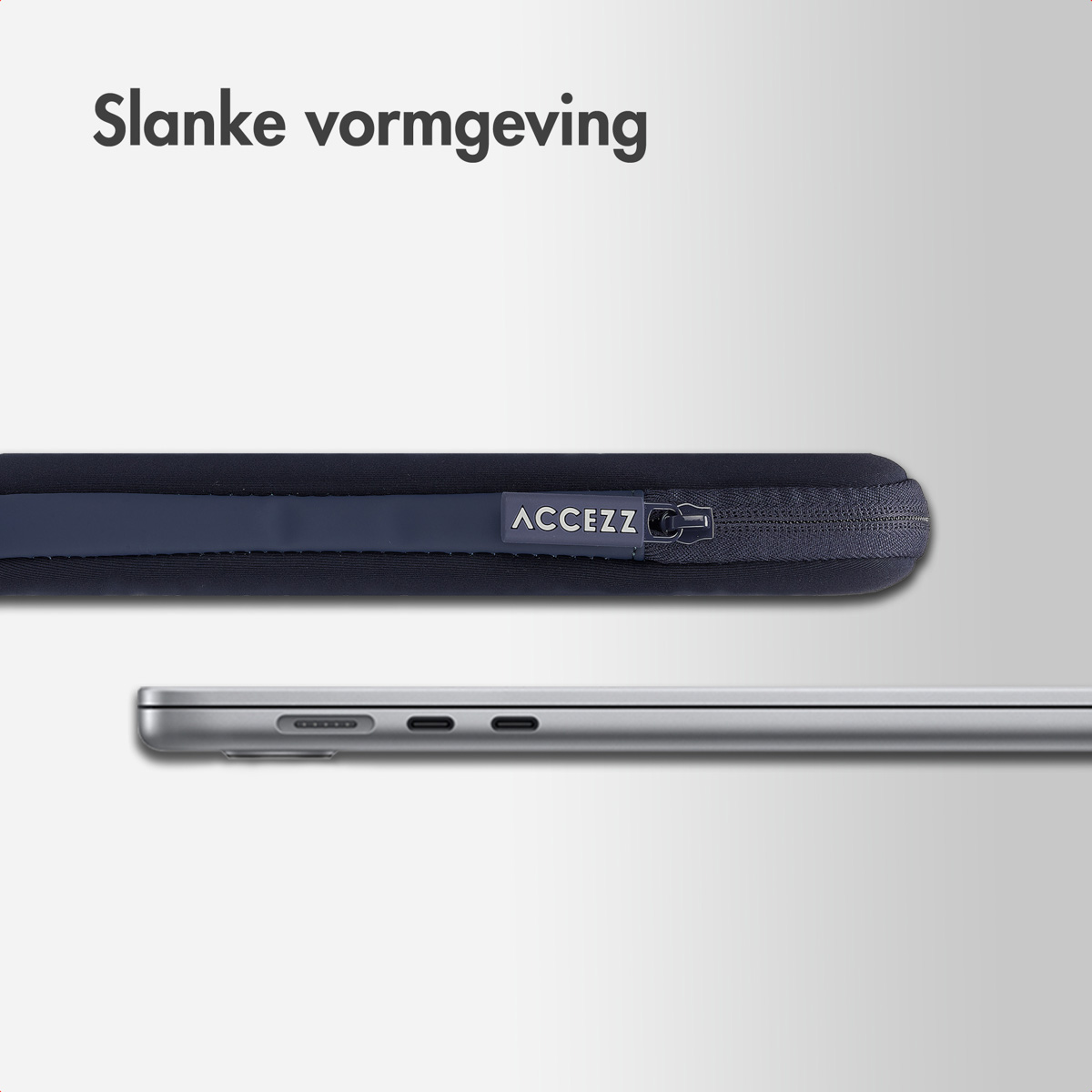 View of laptop edge in navy sleeve, showing zipper, label, and side profile.