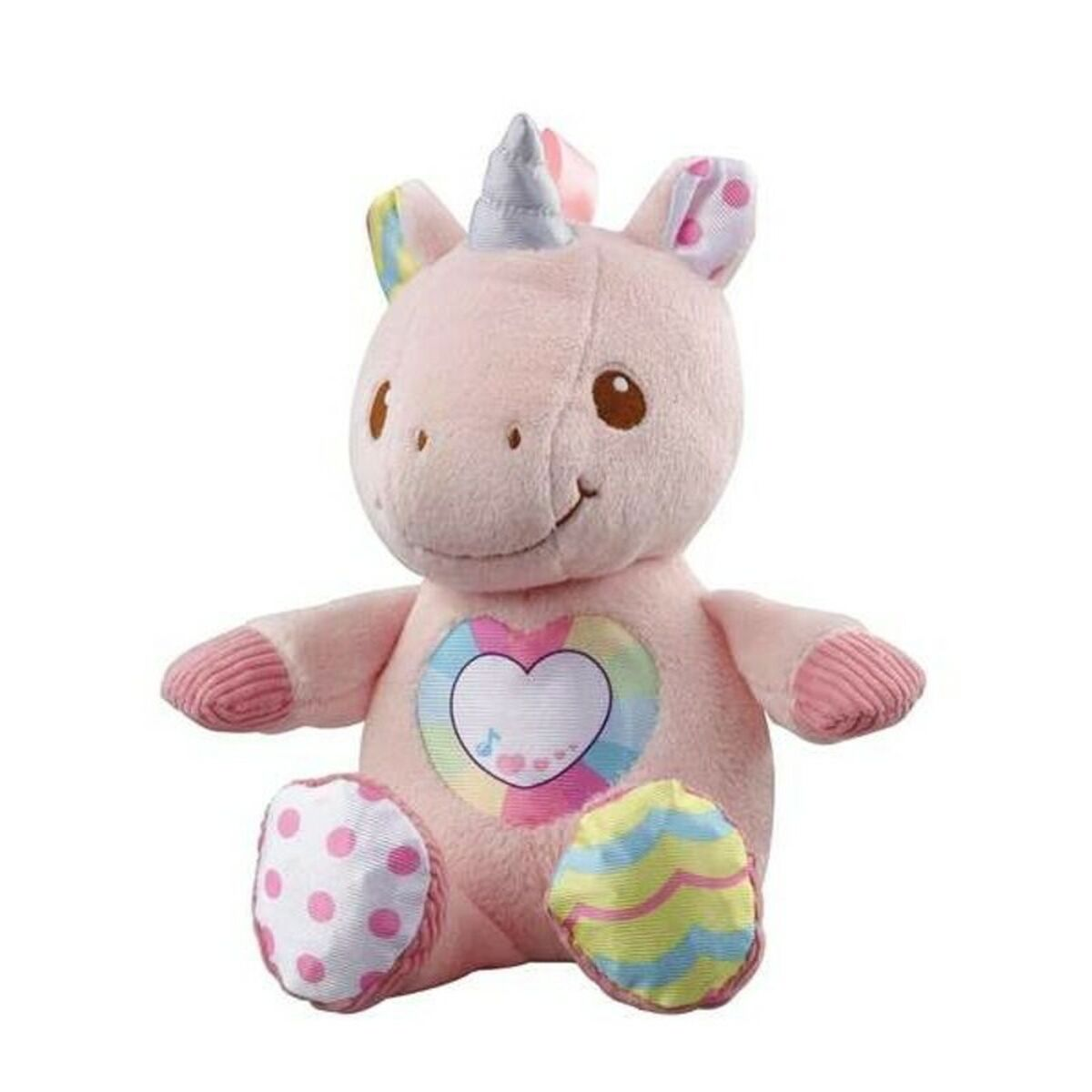 Un peluche de unicornio rosa con un corazón en el pecho está sobre una superficie blanca.