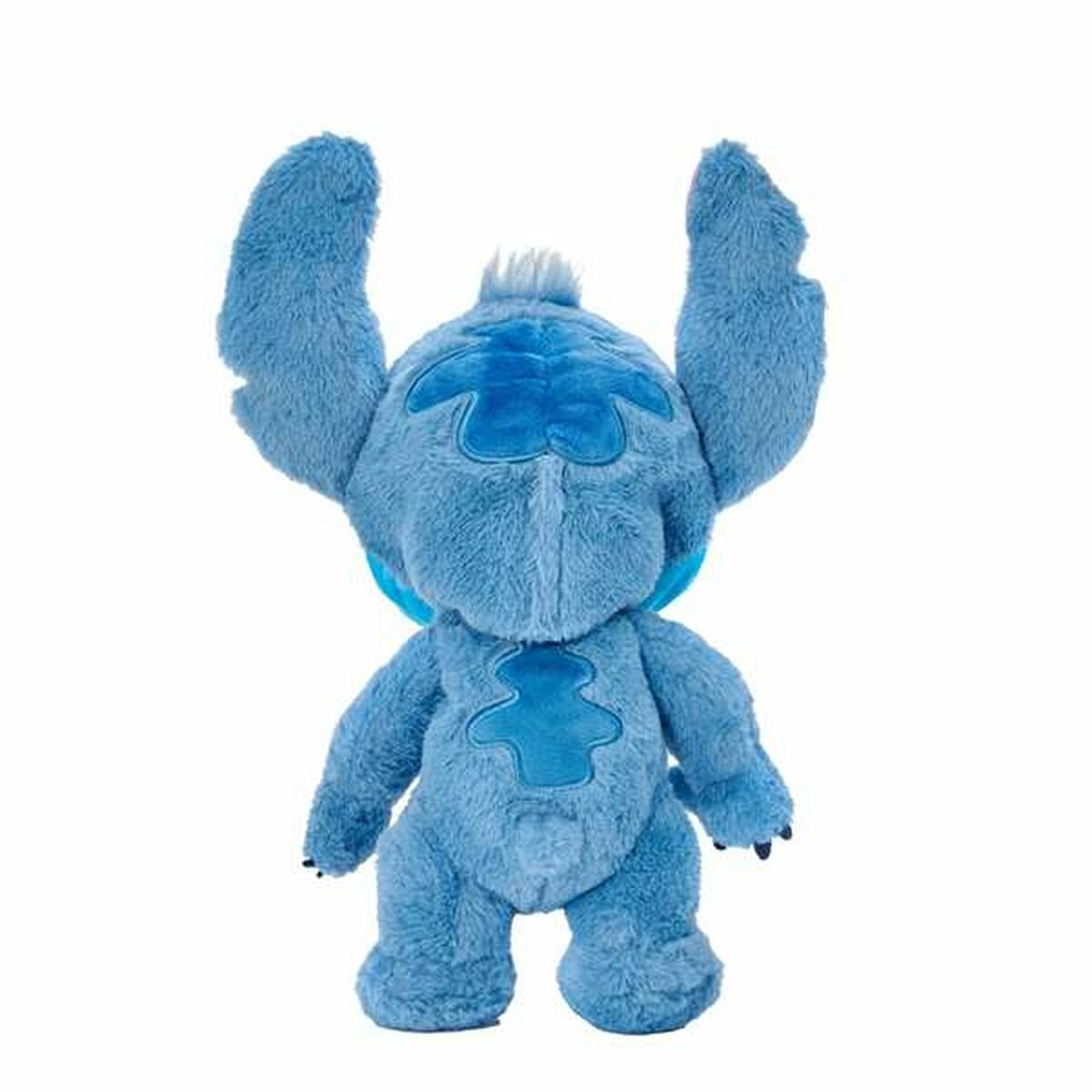 Vista trasera del peluche de Stitch. Cuerpo azul, cola y orejas. Fondo blanco.