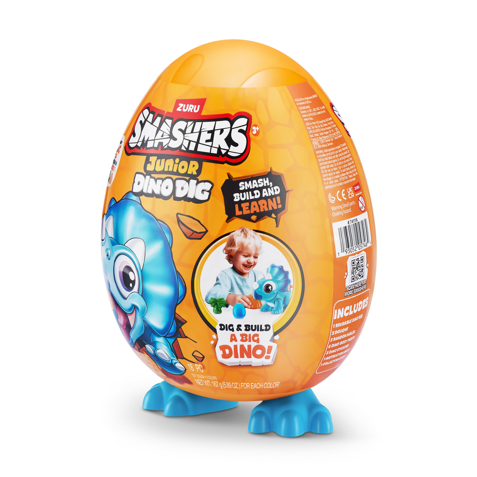 Pomarańczowa zabawka w kształcie jajka. Tekst na opakowaniu: "Smashers Junior Dino Dig". Zawiera figurki dinozaurów.