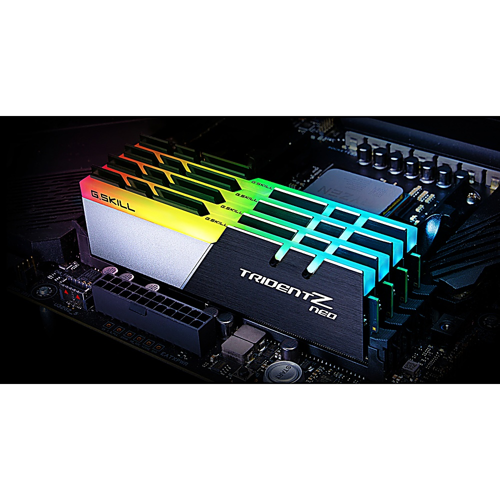 Ein Computer-RAM-Modul mit bunten Lichtern oben, montiert auf einem schwarzen Motherboard.