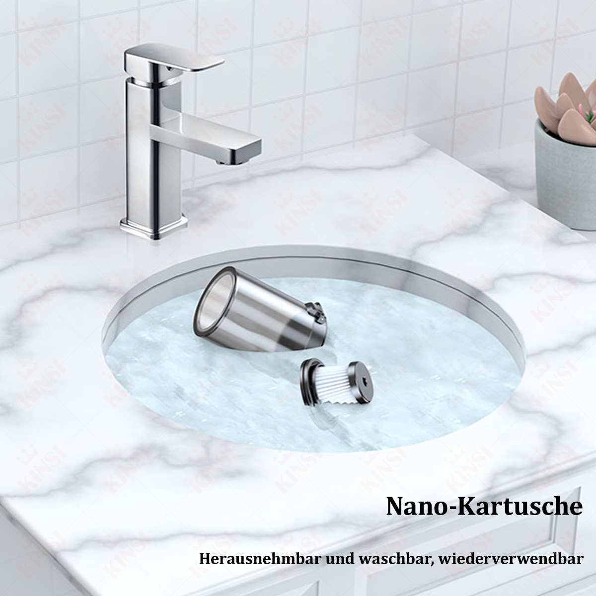 Chromowana bateria, umywalka, filtr i doniczka na marmurowym blacie. Filtr jest wyjmowany.