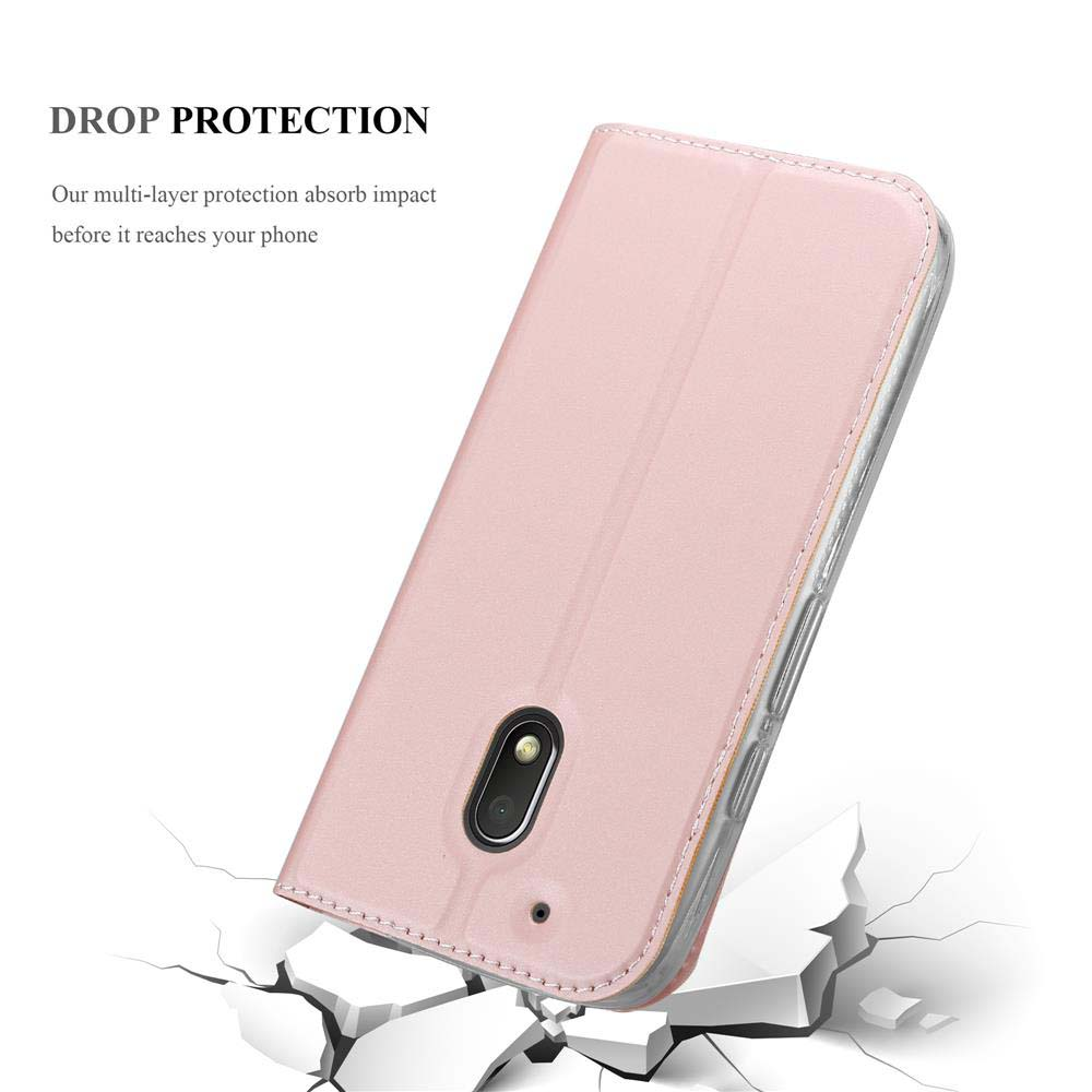 Custodia rosa con telefono all'interno. La custodia è aperta e il terreno incrinato è sotto il telefono.