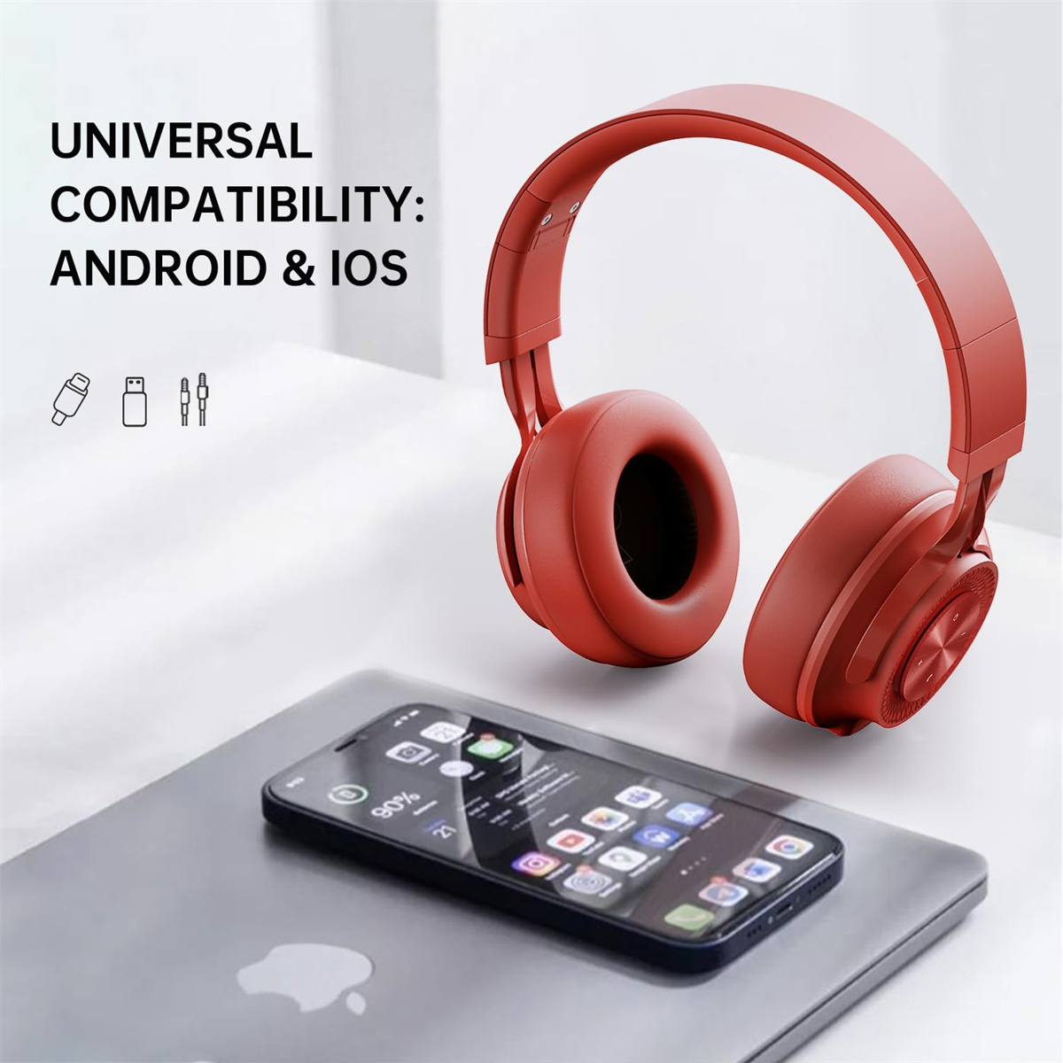 Rote Kopfhörer neben einem schwarzen Smartphone auf weißer Oberfläche. Text: 'UNIVERSAL COMPATIBILITY: ANDROID & IOS'.