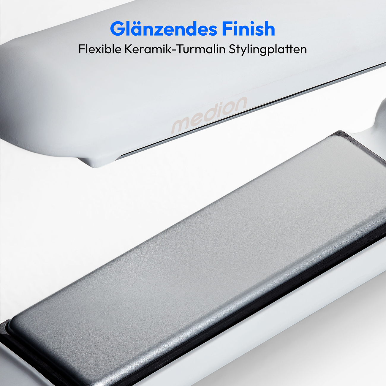 Witte stijltang met glanzende, grijze keramische platen, close-up.