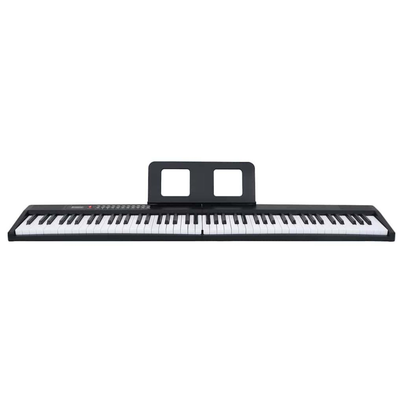 Schwarzes Digitalpiano mit Ständer. Weiße Tasten. Isoliert auf weißem Hintergrund. Draufsicht.