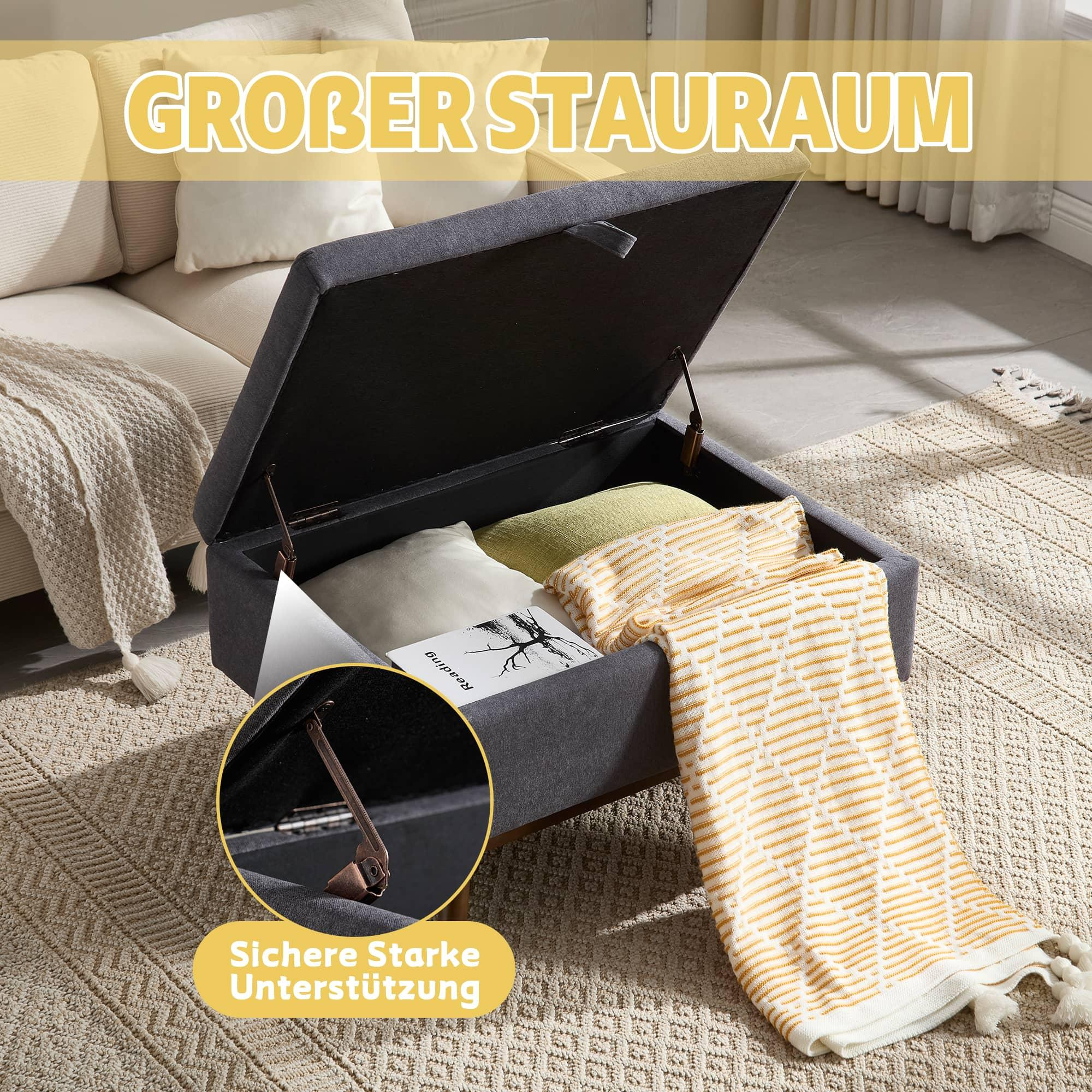 Aufbewahrungshocker mit offenem Deckel. Im Inneren befinden sich Kissen und Decken. Text sagt 'großer Stauraum'.