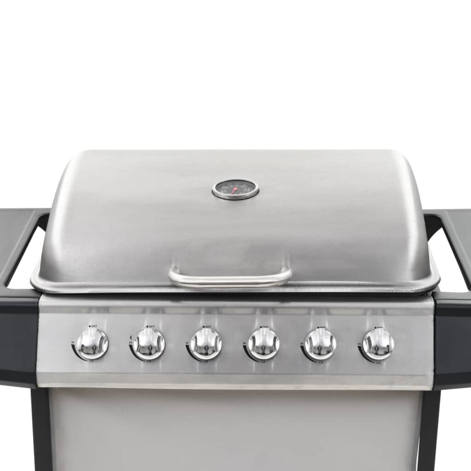 Grill mit geschlossenem Edelstahl-Deckel. Knöpfe vorne. Thermometer am Deckel.