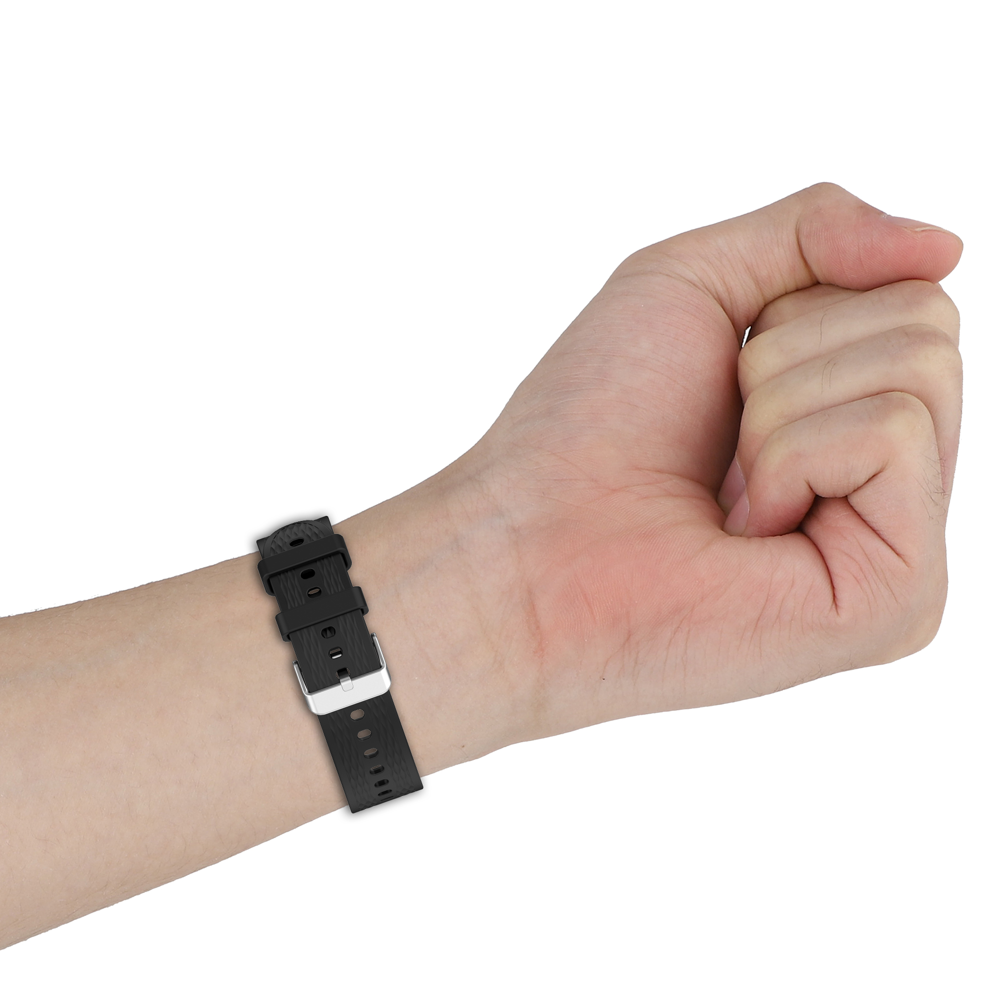 Cinturino nero su un polso. Fibbia allacciata. La mano è pallida.