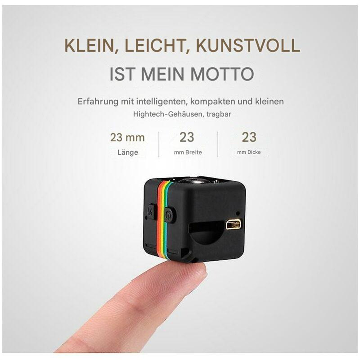 Eine kleine schwarze Kamera mit farbigen Streifen. Text zeigt die Abmessungen: 23mm x 23mm x 23mm.