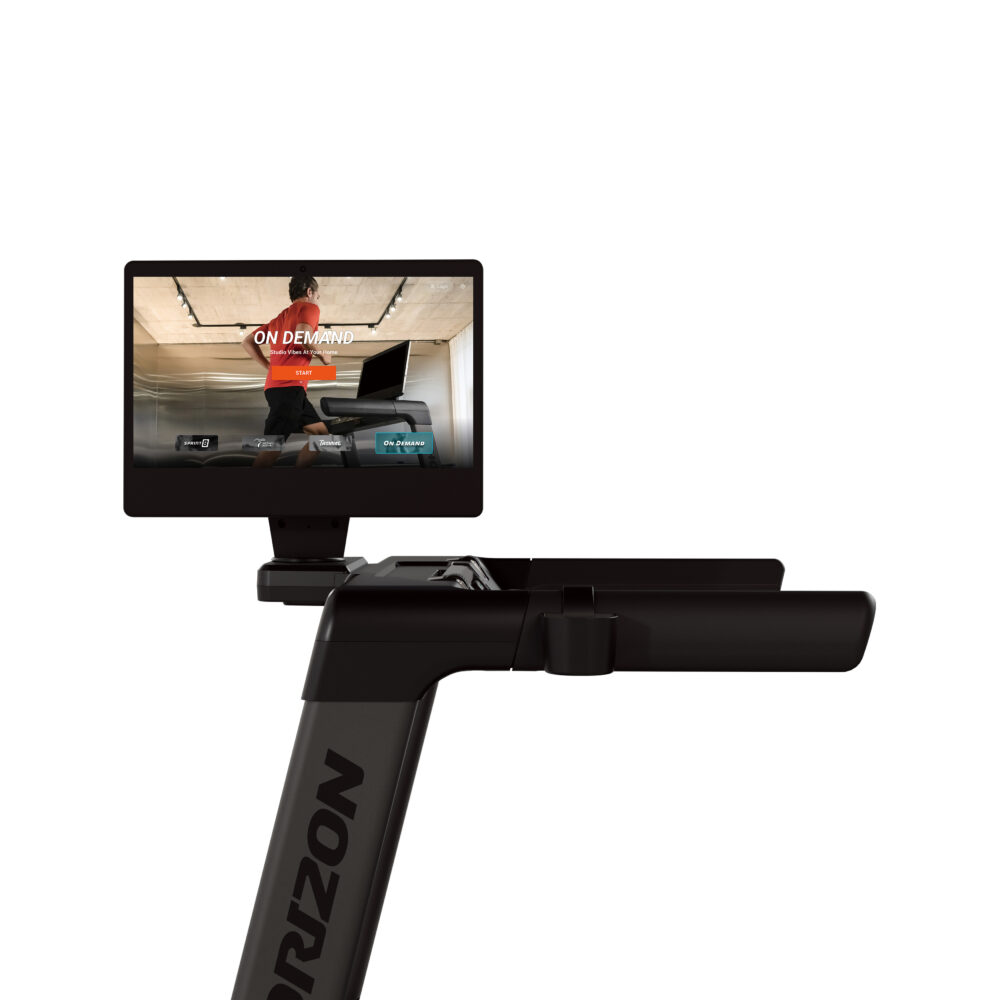 Close up of treadmill screen, displaying a person running. The screen shows an on-demand option.