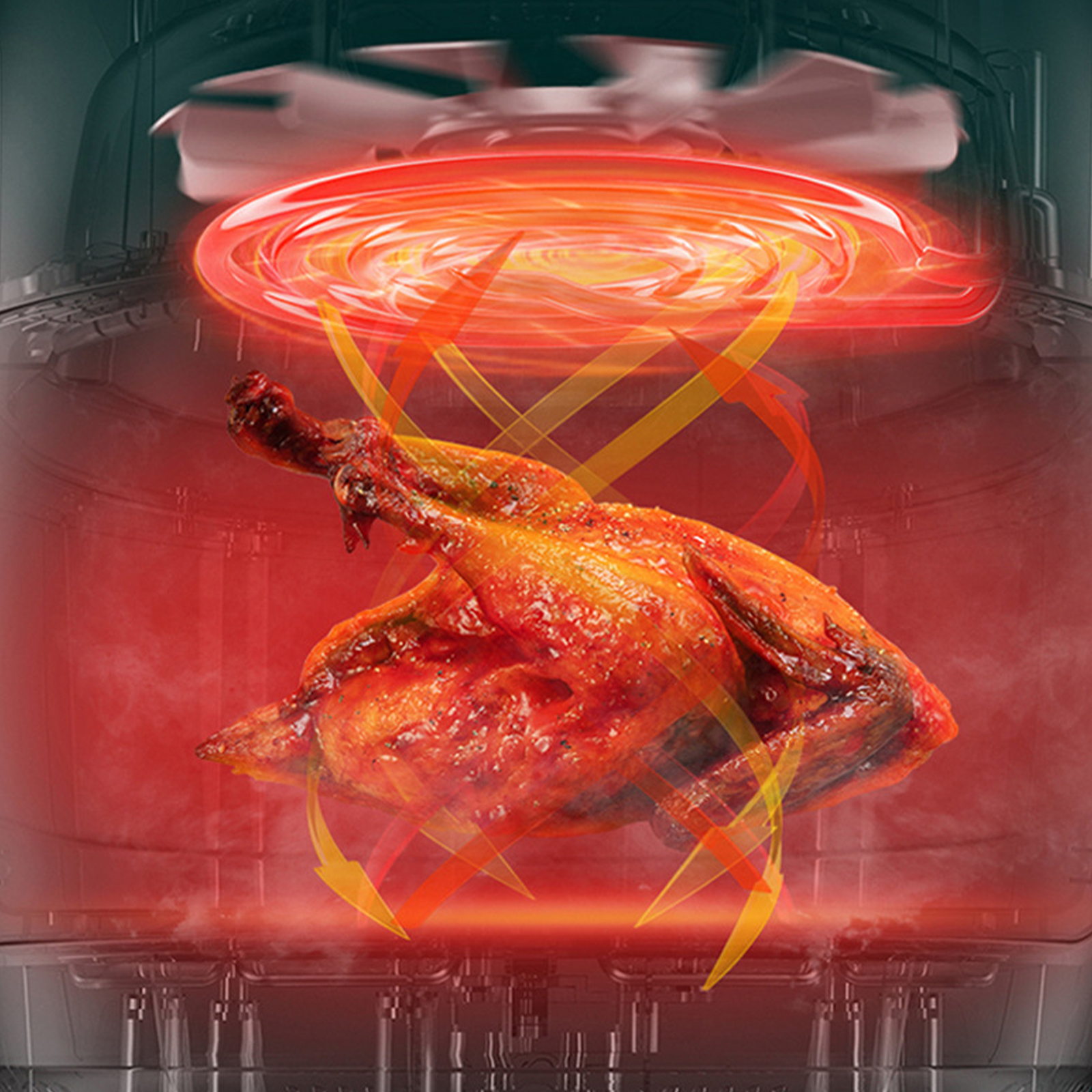 Hähnchen, das in einer rot beleuchteten Heißluftfritteuse gart.