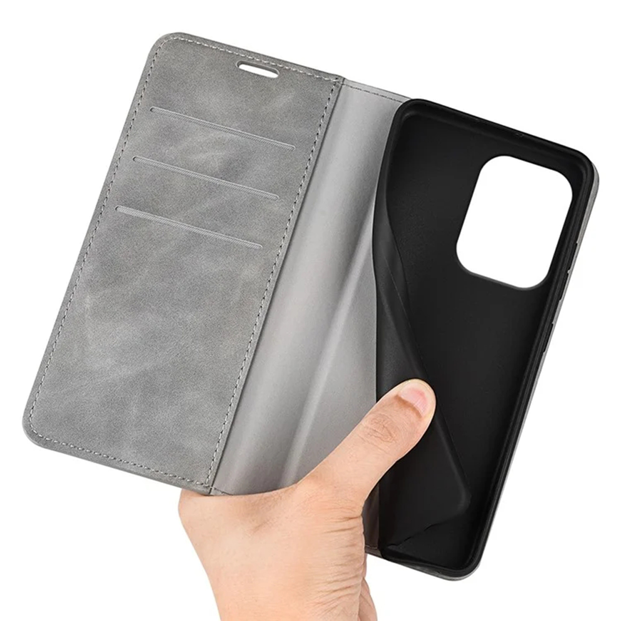 Grijze telefoonhoes open. Toont de binnenkant met een telefoon. Hand houdt de hoes vast.