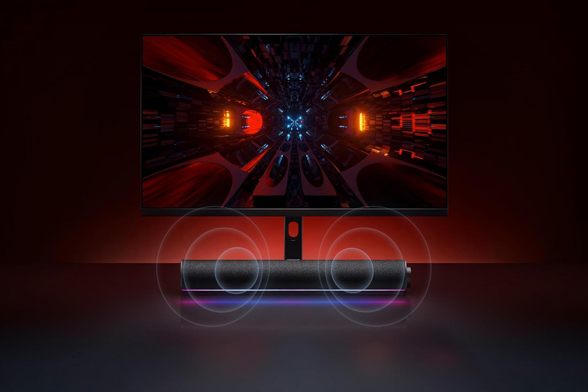 Monitor wyświetlający tunel z głośnikiem poniżej. Scena oświetlona jest czerwonym światłem.