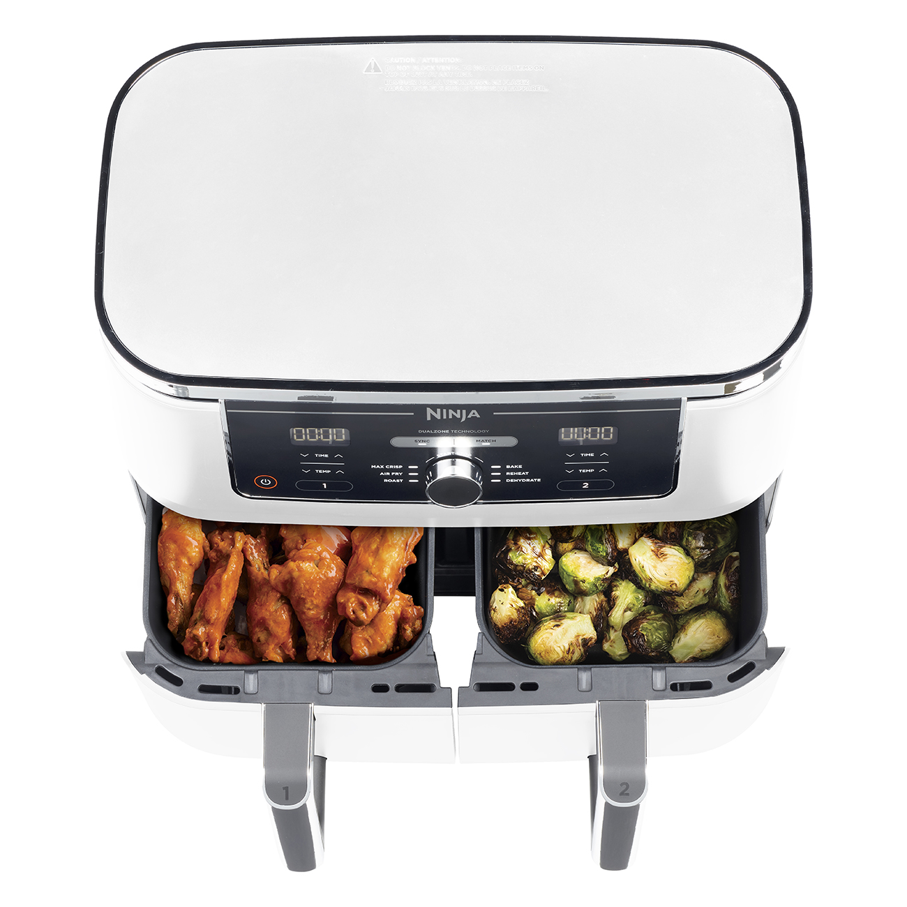 Biało-czarna frytkownica powietrzna z dwoma koszami. Jeden ze skrzydełkami, drugi z kiełkami.