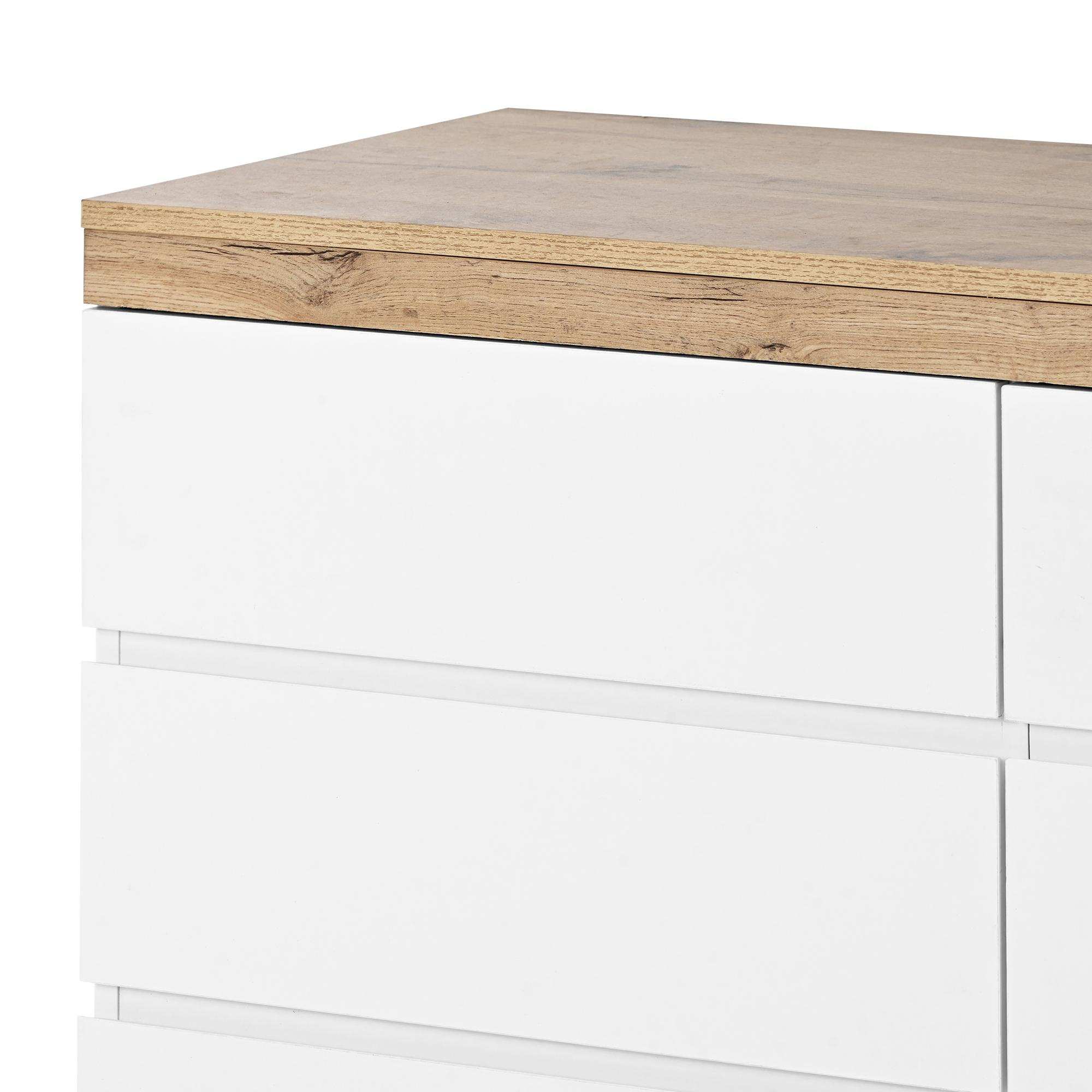 Nahaufnahme einer weißen Kommode mit Holzplatte.