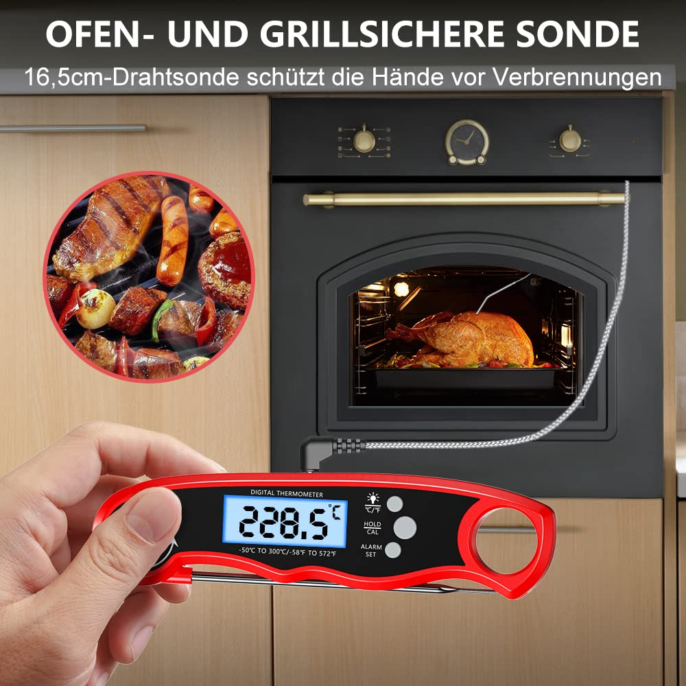 Rotes digitales Thermometer mit Steak und Ofen im Hintergrund, zeigt 228,5°F an.