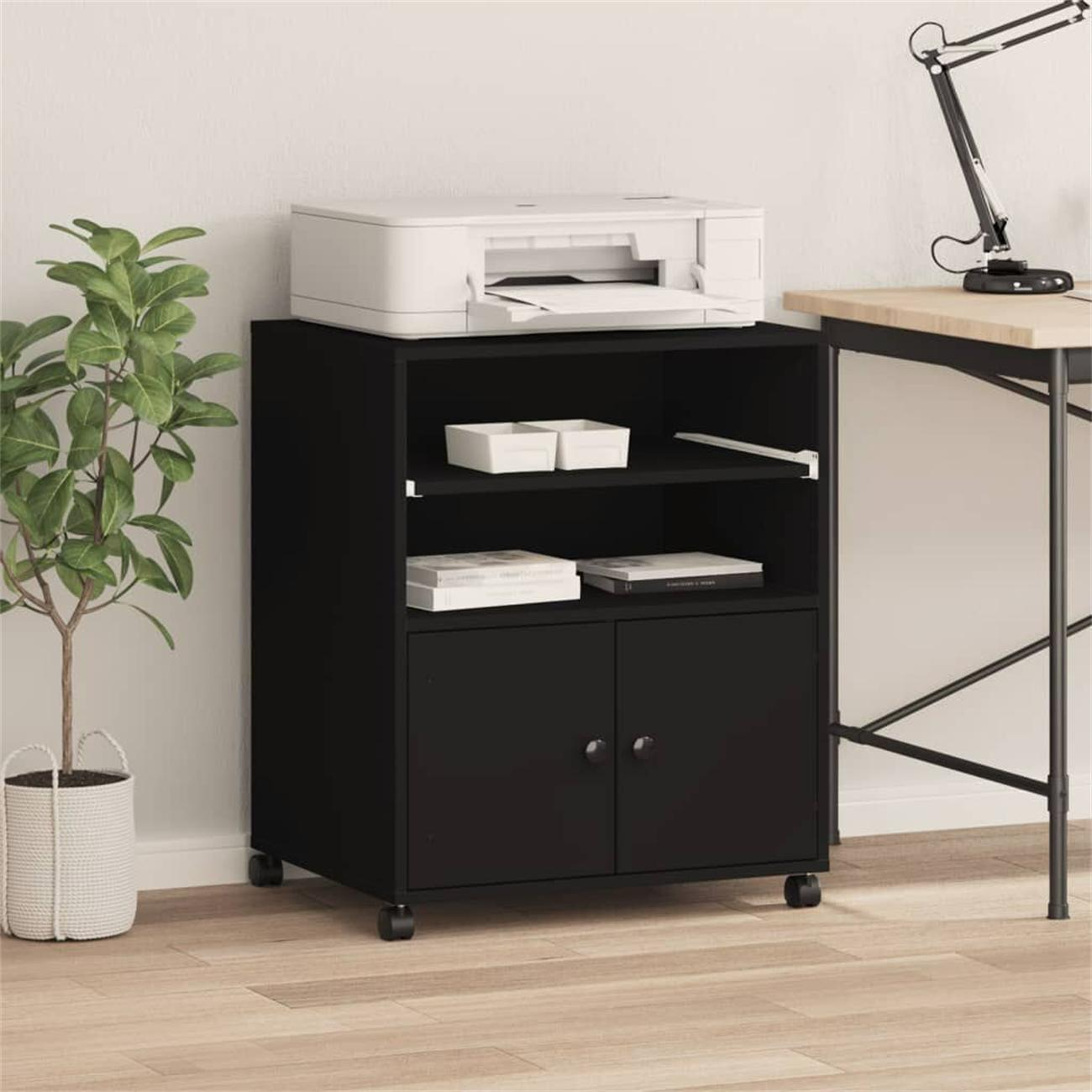 Schwarzer Schrank mit Drucker, Büchern und Pflanze.