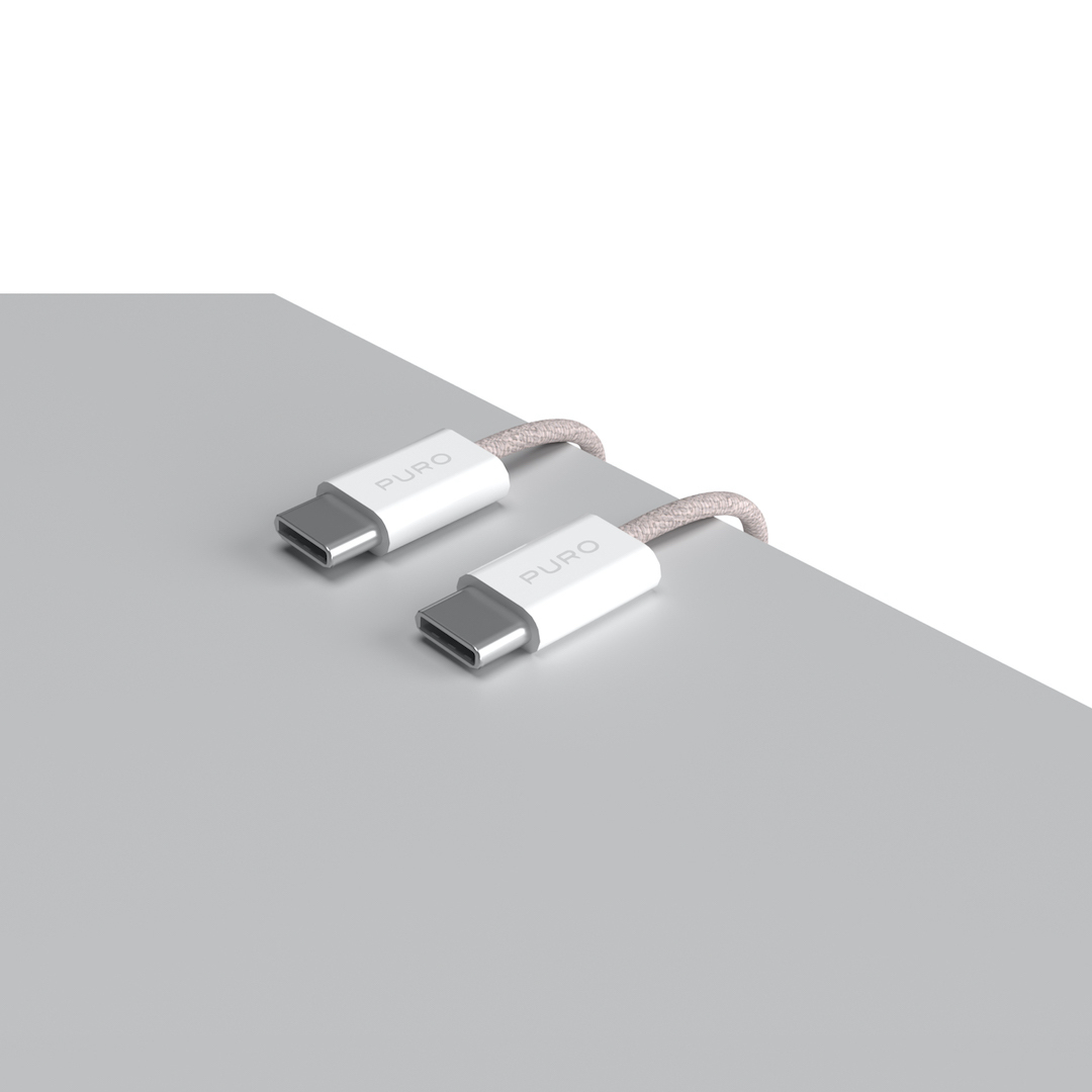 Zwei USB-C-Anschlüsse mit weißen Blöcken und rosa geflochtenen Kabeln auf Grau.