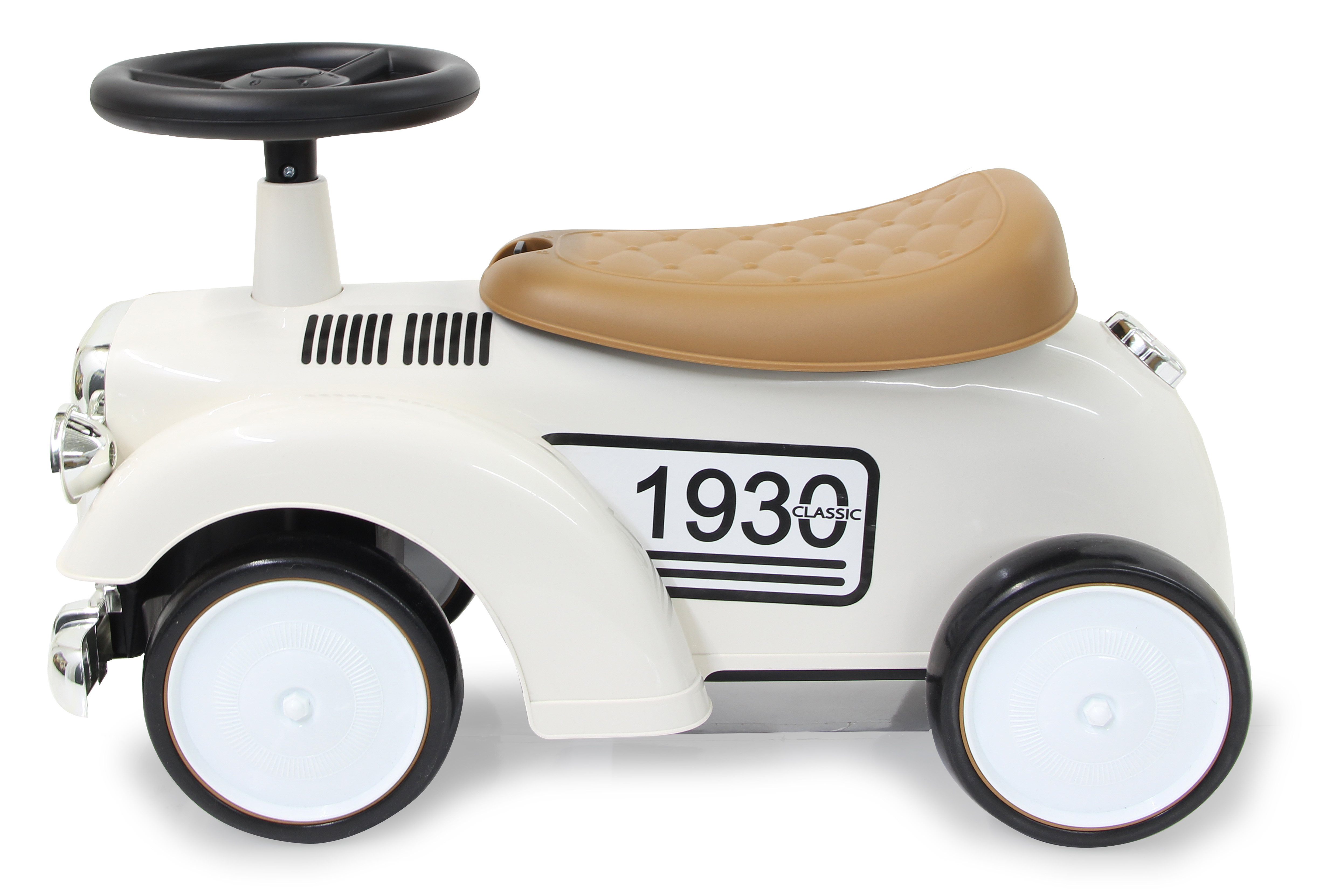 Biały zabytkowy samochodzik z brązowym siedzeniem, czarną kierownicą i numerem 1930.