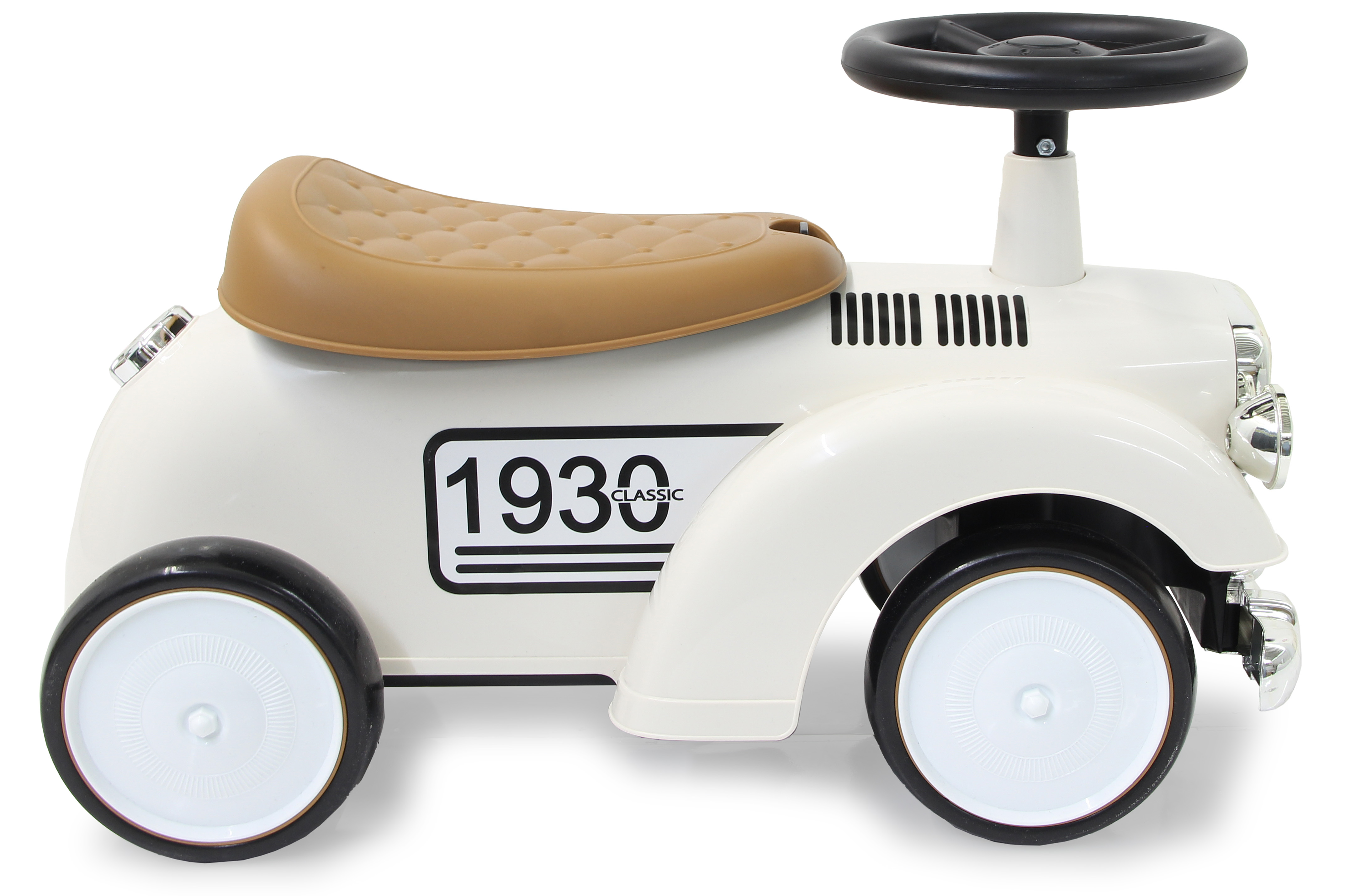 Biały zabytkowy samochodzik, brązowe siedzenie, czarna kierownica, numer 1930 i czarne koła.