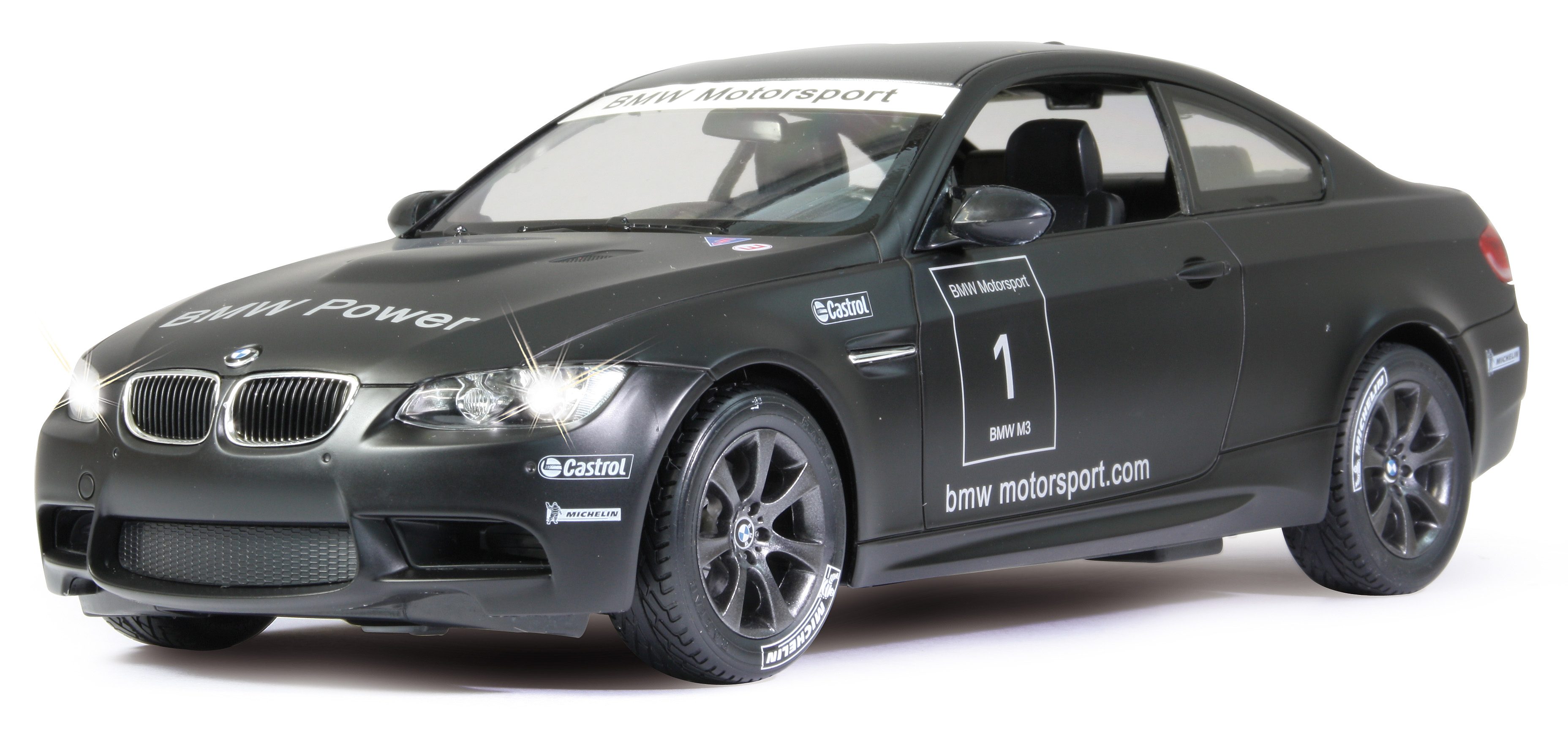 Czarny samochodzik BMW M3 z marką BMW Motorsport i włączonymi reflektorami. Koła są czarne.