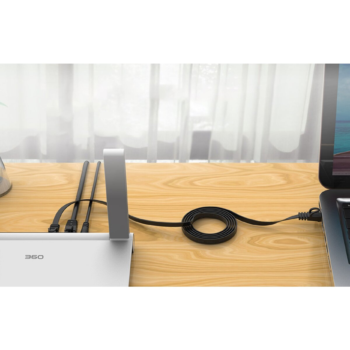 Netzwerkeinrichtung mit Router, Kabeln und Laptop. Holztisch.