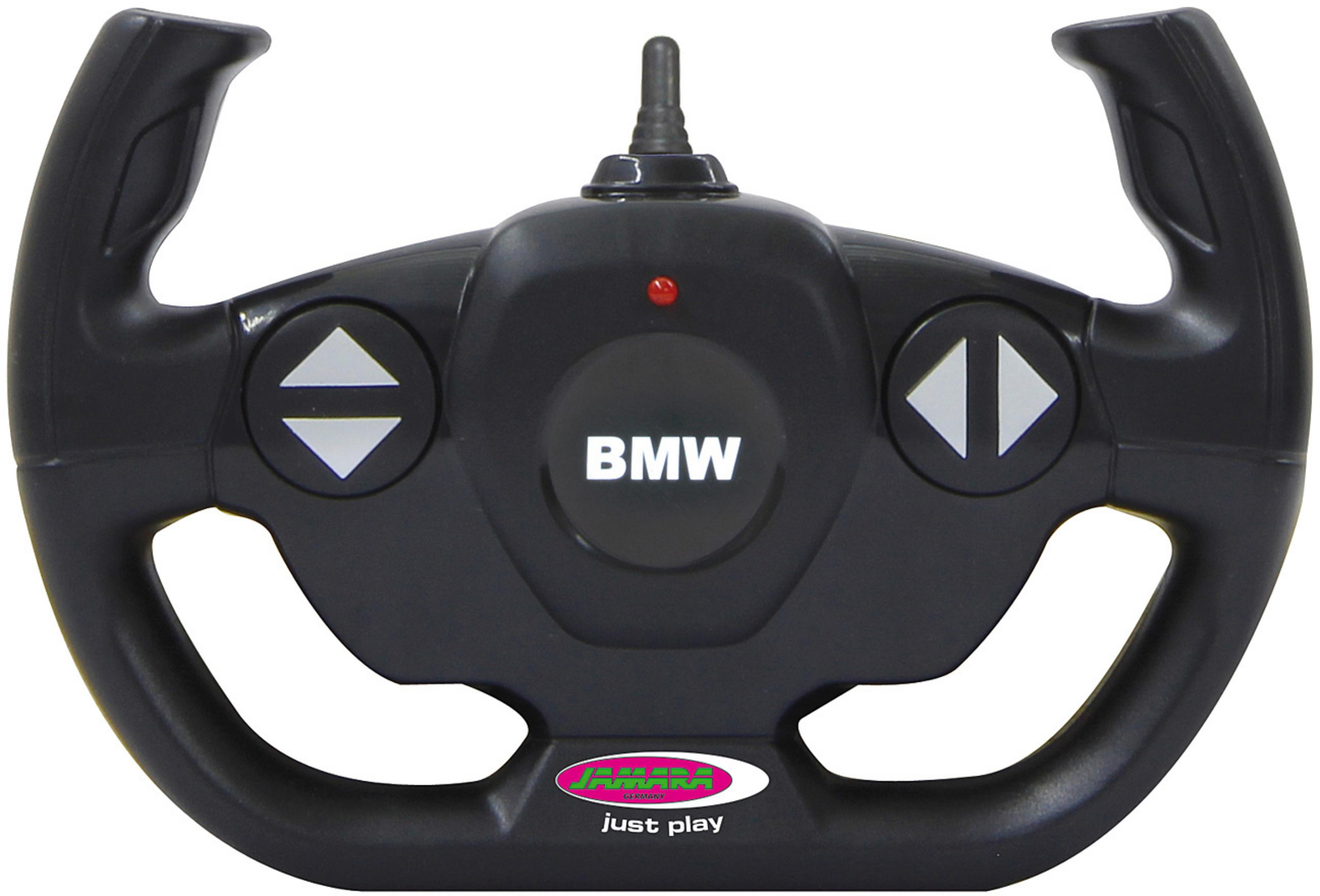 Schwarze BMW-Spielzeug-Lenkrad-Fernbedienung. Pfeile zeigen nach links und rechts. 'BMW' ist geschrieben.