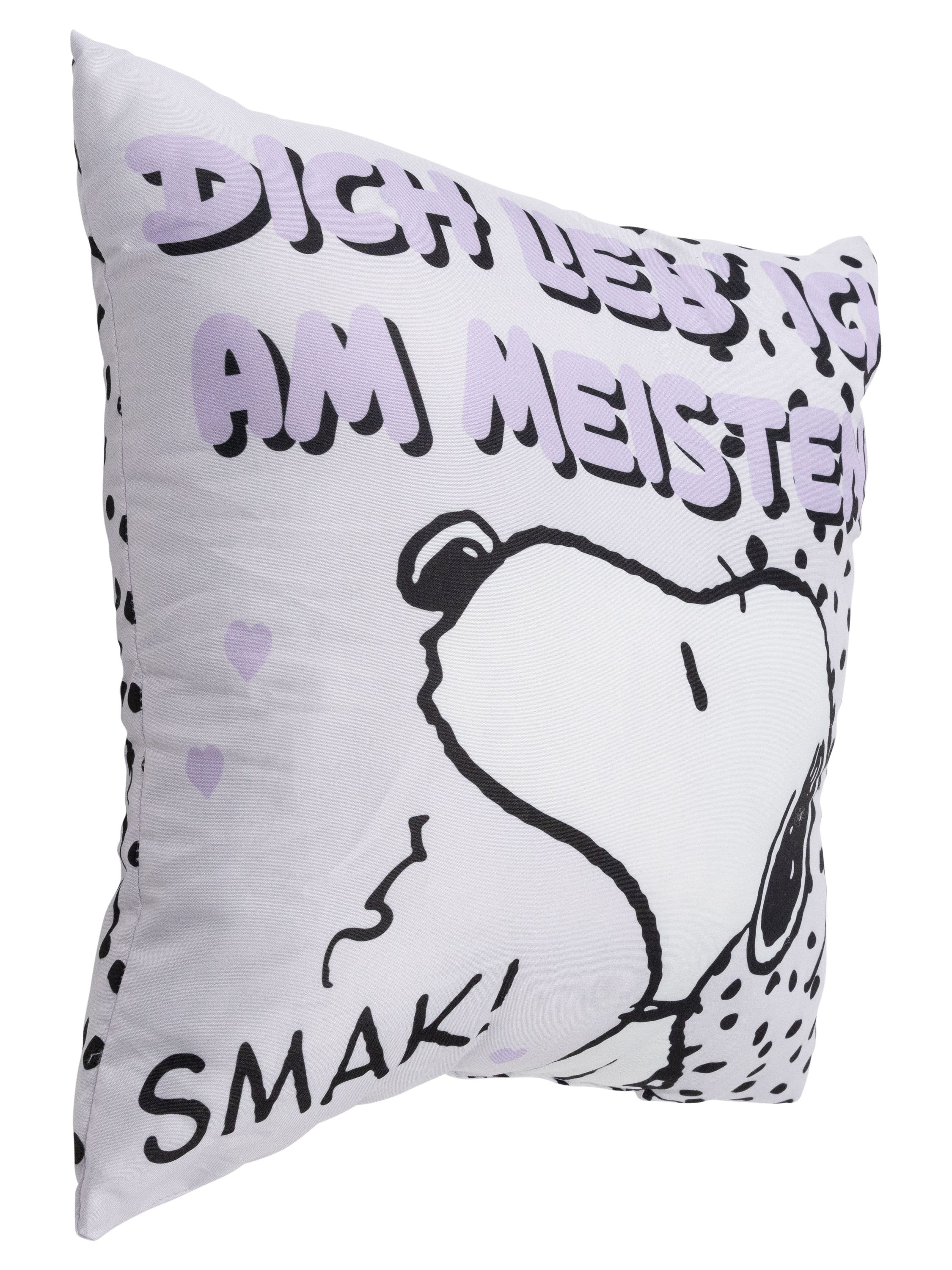 Ein Kissen mit Snoopy darauf. Es hat einen weißen Hintergrund mit lila Text.