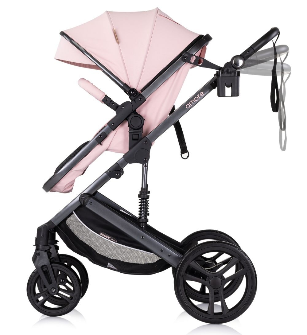 Rosa Kinderwagen, schwarzer Rahmen, Seitenansicht, weißer Hintergrund.