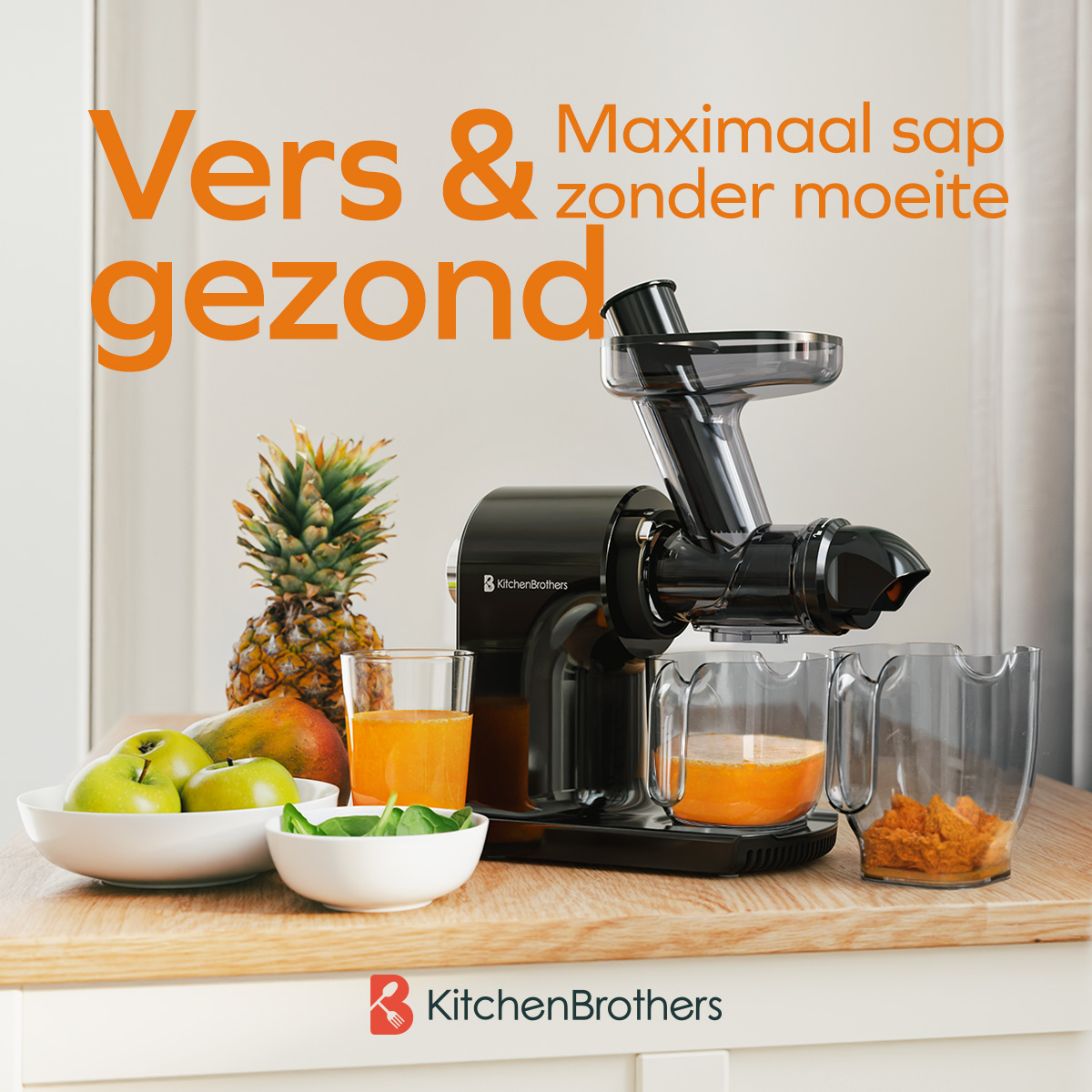 Black juicer with fruit, juice, and a pineapple on a wood surface.